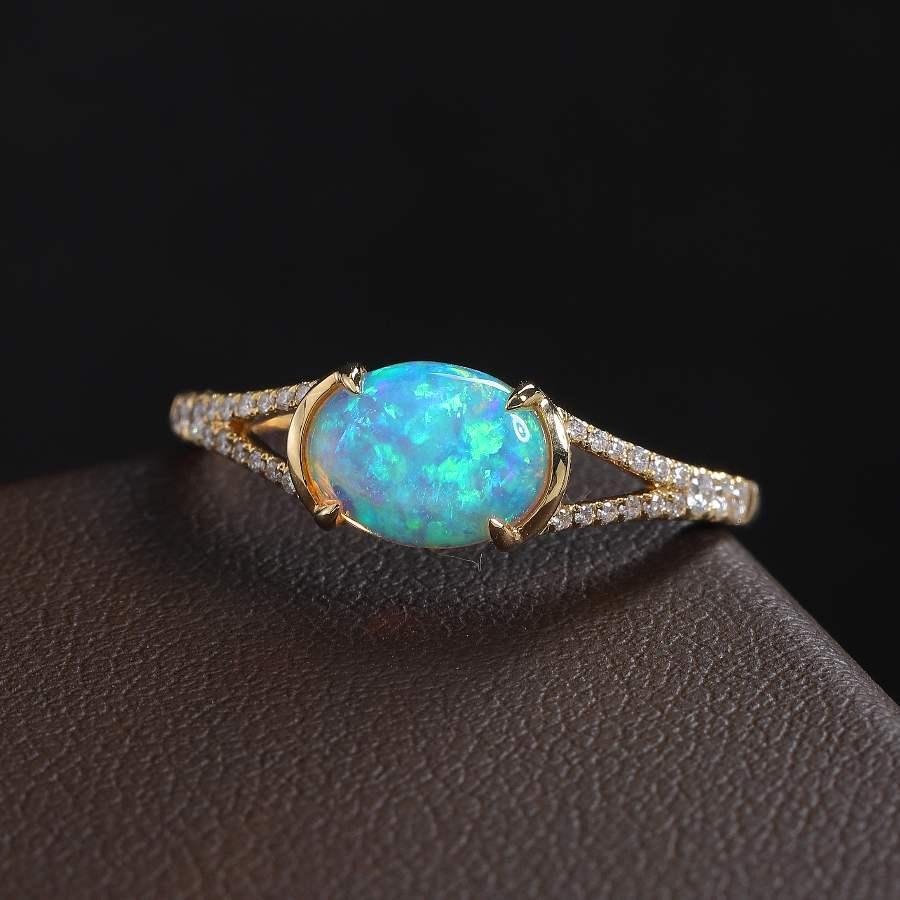 Semi Black Opal Split Shank Engagement Ring with Pave Setting 18K Yellow Gold.



Free Domestic USPS First Class Shipping!  Free One Year Limited Warranty!  Free Gift Bag or Box with every order!



Opal—the queen of gemstones, is one of the most