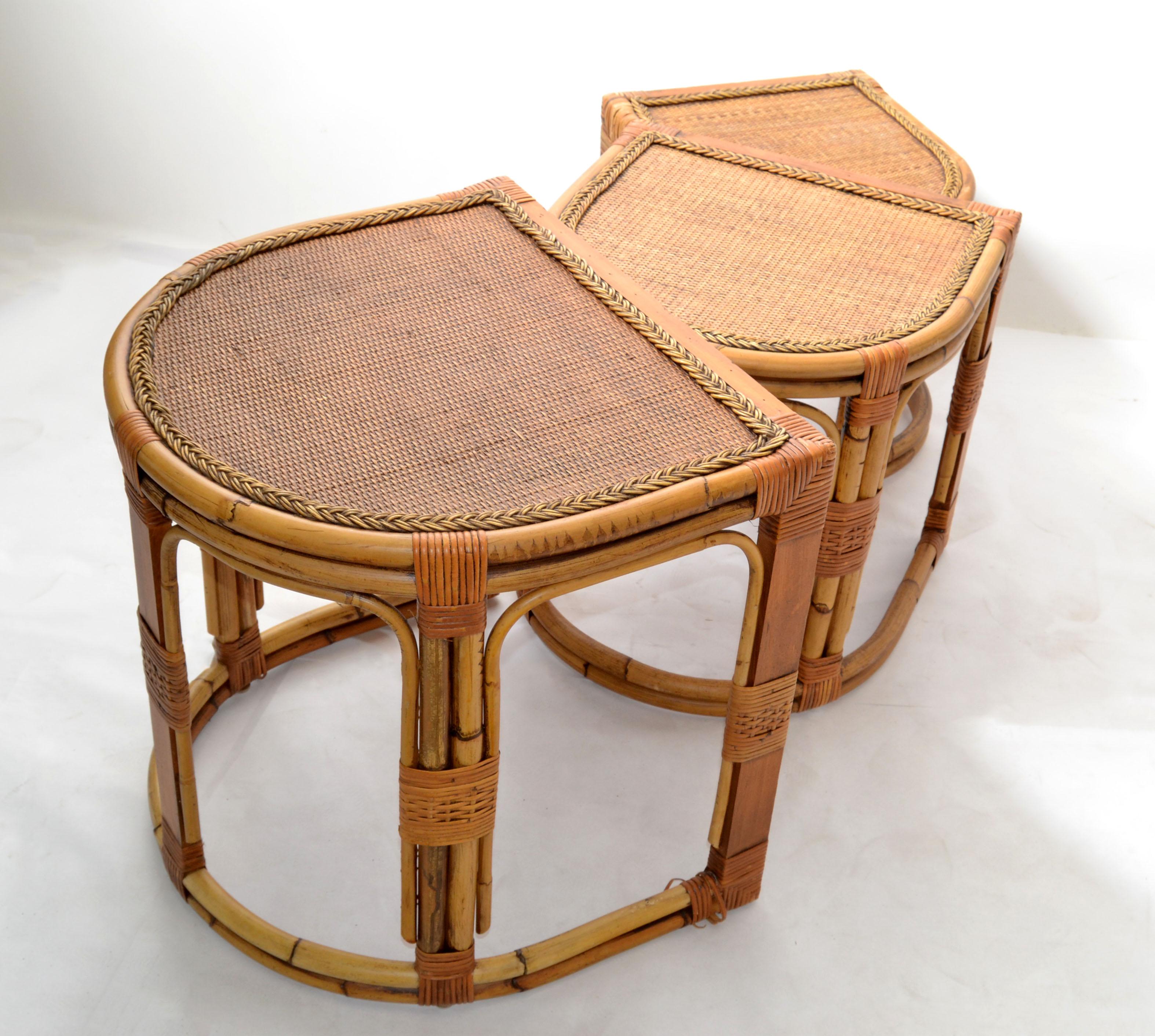 Mid-Century Modern Bohemian style semi-circle bent bamboo & handwoven cane top set of 3 nesting tables or stacking tables.
Each occasional table has a hand braided cane Top Border. 
Size of each table:
20 D x 22 L x 22 inches H.
19.25 D x 19.25