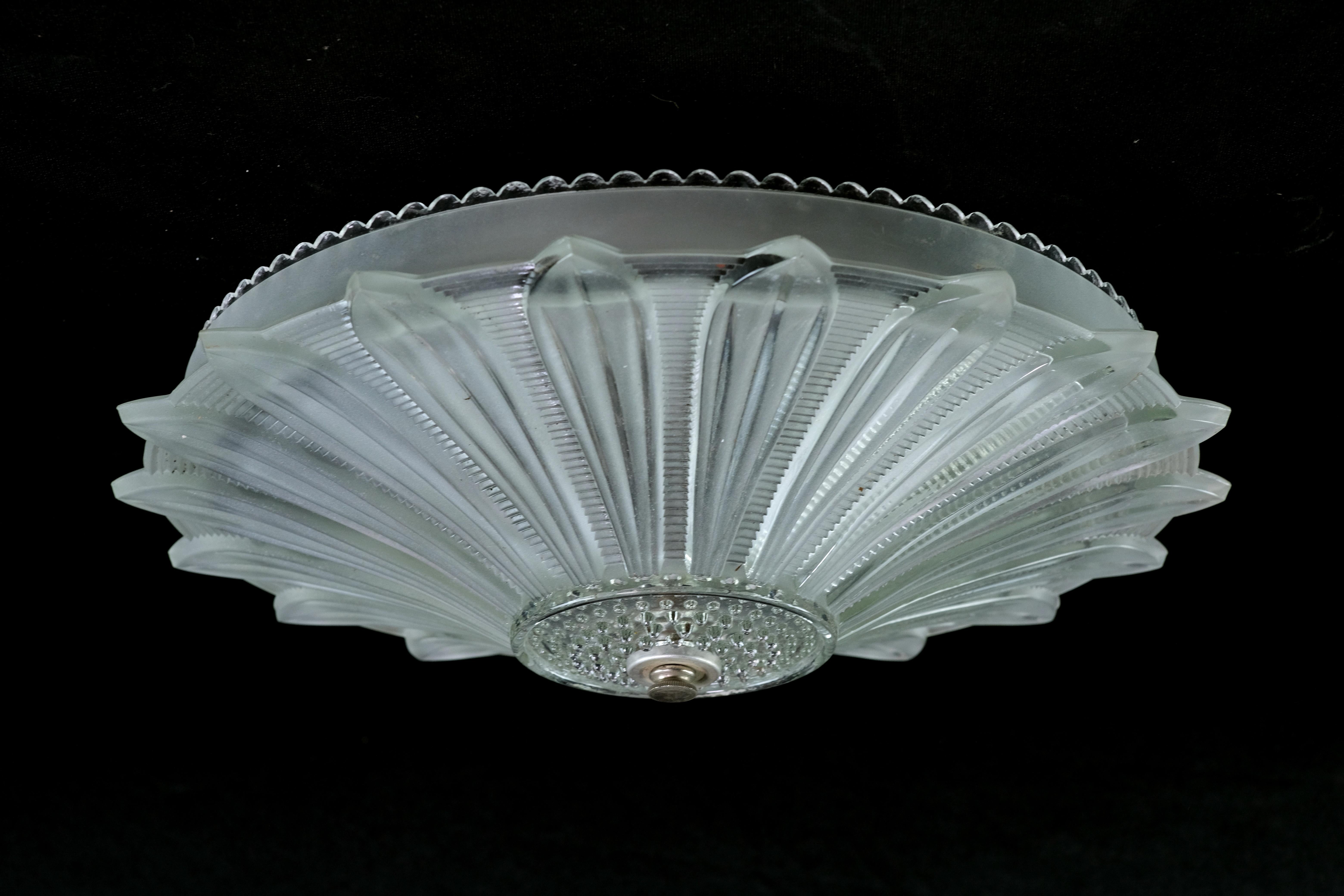1940s Semi flush cast glass daisy floral dish light featuring intricately detailed petals radiating from a textured and dotted center. Features three E-26 sockets for lots of light.