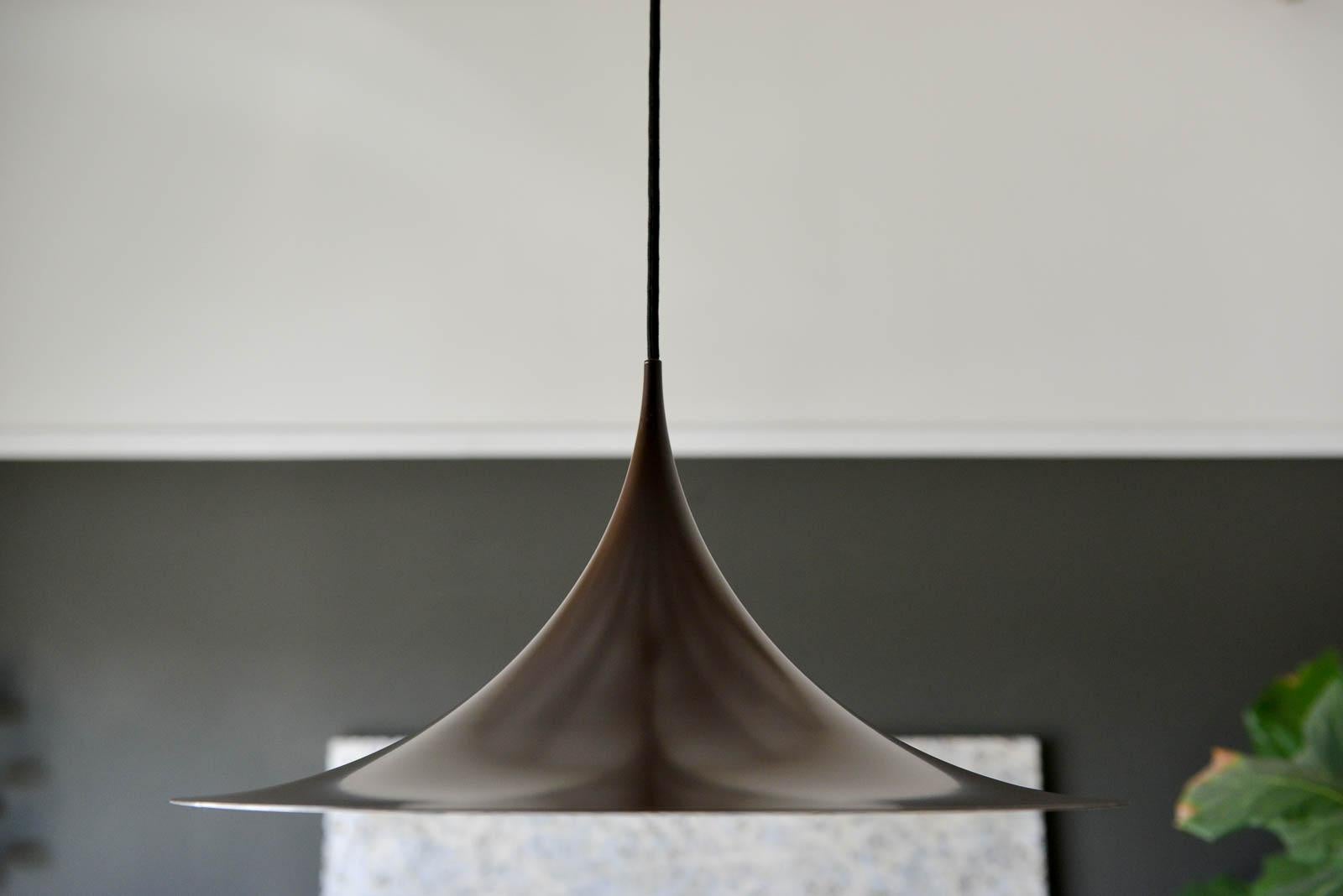 Semi pendant enameled metal light by Torsten Thorup & Claus Bonderup for Fog & Morup, circa 1965. Original chocolate brown enameled metal color, offered in catalog dated 1970. Comes with original cord, measuring 32