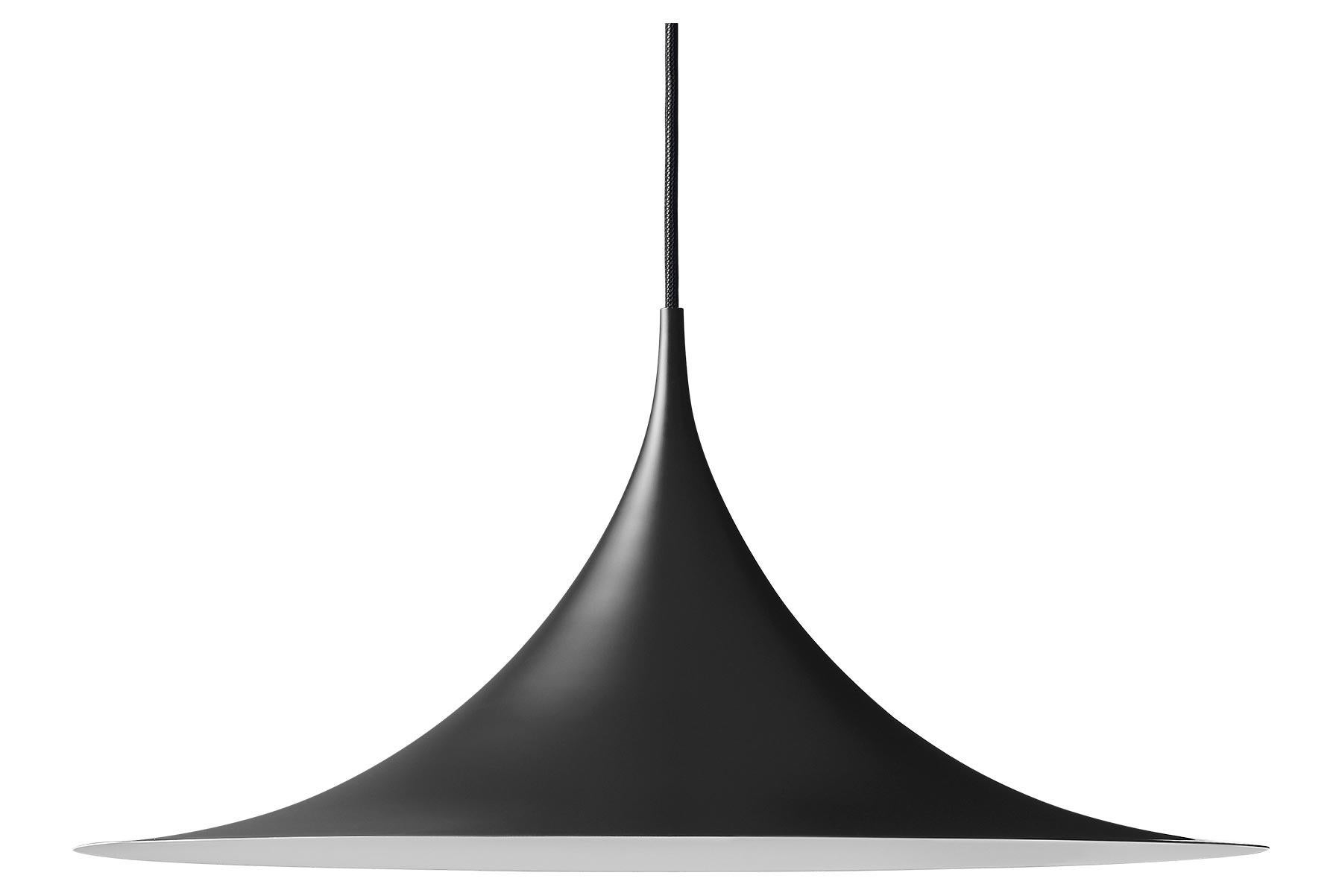 The Semi Pendant is a unique pendant lamp, based on two quarter-circles put together, back-to-back. It’s distinctive arch-shaped, enamelled metal shade creates a diffused, cone-shaped light, ideal over a dining table or kitchen work surface. With