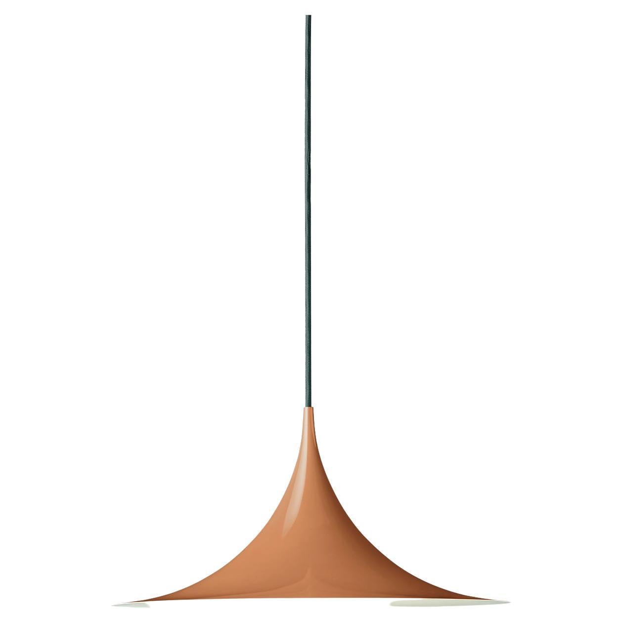 The semi pendant is a unique pendant lamp, based on two quarter-circles put together, back-to-back. It’s distinctive arch-shaped, enamelled metal shade creates a diffused, cone-shaped light, ideal over a dining table or kitchen work surface. With