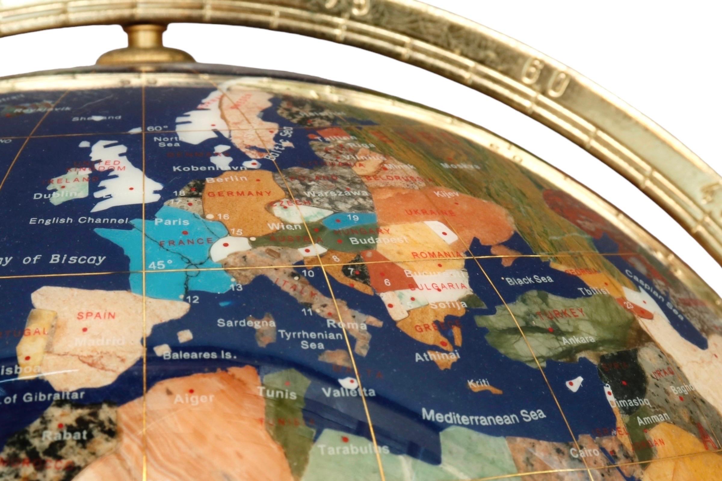 gemstone globe on brass stand