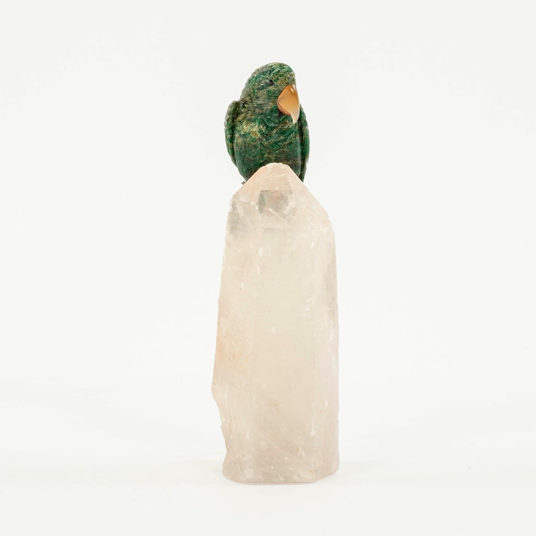 Intricately carved and lifelike serpentine macaw with onyx eyes, agate beak and silver gilt feet perched on rock crystal. Superior workmanship and semi-precious gemstones makes this New World parrott a great addition to any collector or bird lover.