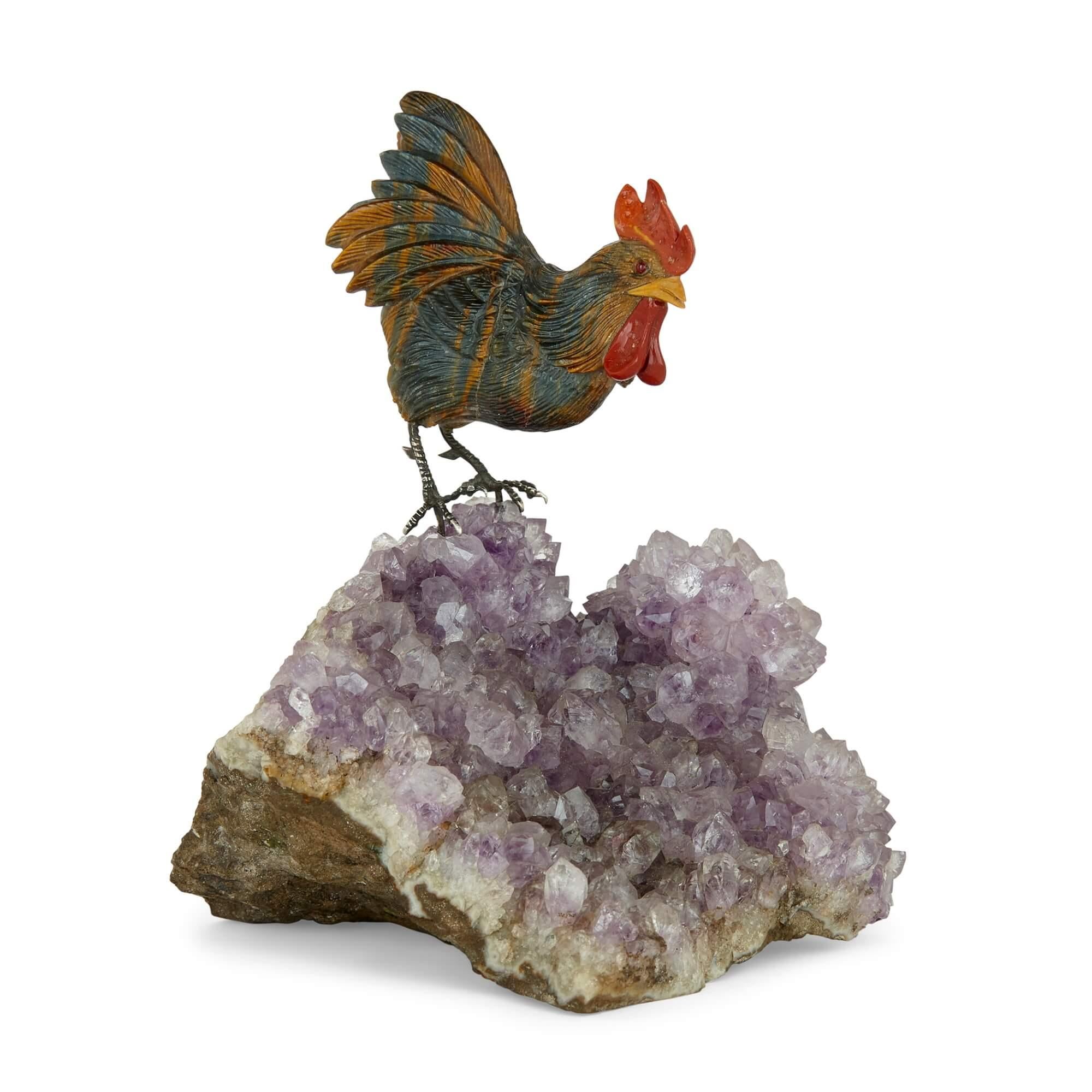 Semi-precious stone and silver model of a cockerel 
Continental, 20th Century 
Height 12cm, width 10cm, depth 10cm

This objet d’art is made from a selection of high quality materials. The cockerel, a symbol of good luck and prosperity is