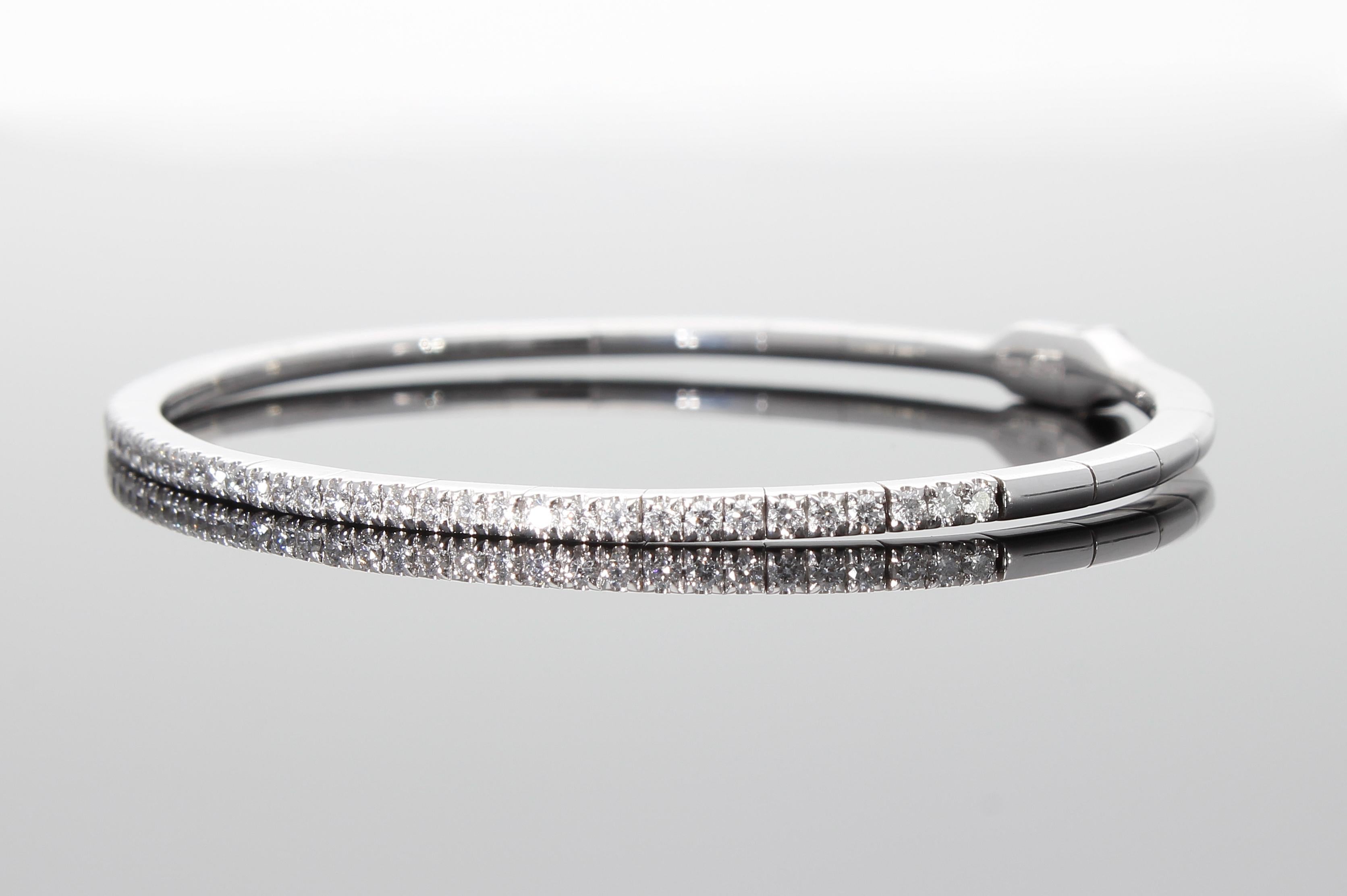 Modern Semi-rigid bracelet with a row of 0.64 ct of Diamonds. For Sale