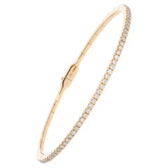Semi-rigid bracelet with a row of 0.75 ct of Diamonds. Gold 18 Kt. Made in Italy