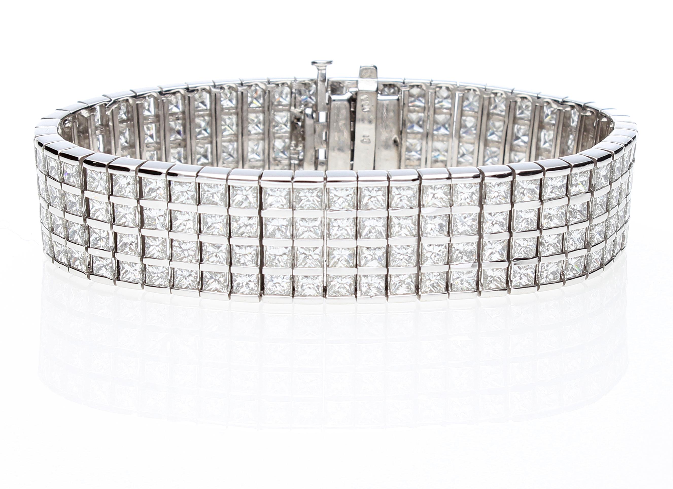 Semi-rigid bracelet with 204 princess cut diamonds total weight about 20.00 ct.
The bracelet is made up of 4 rows of princess cut diamonds, each diamond is set between two white gold rails. 
The bracelet has a retractable closure and also an