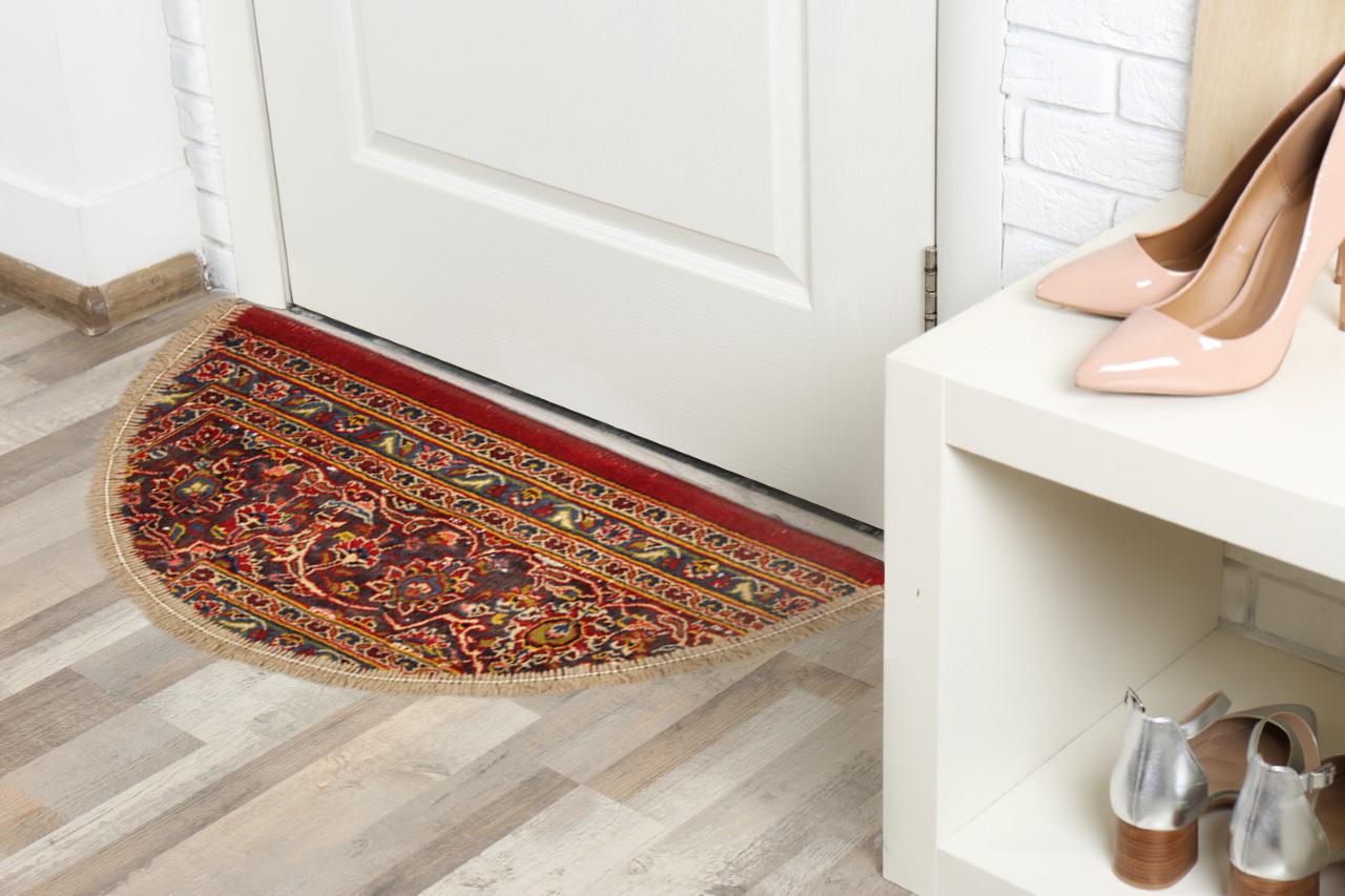 Red, purple, yellow and blue have all been woven into this vibrant doormat, featuring a layered floral pattern. Perfect for any interior doorway, in any modern or traditional home. This semicircle entranceway doormat has been refurbished from a