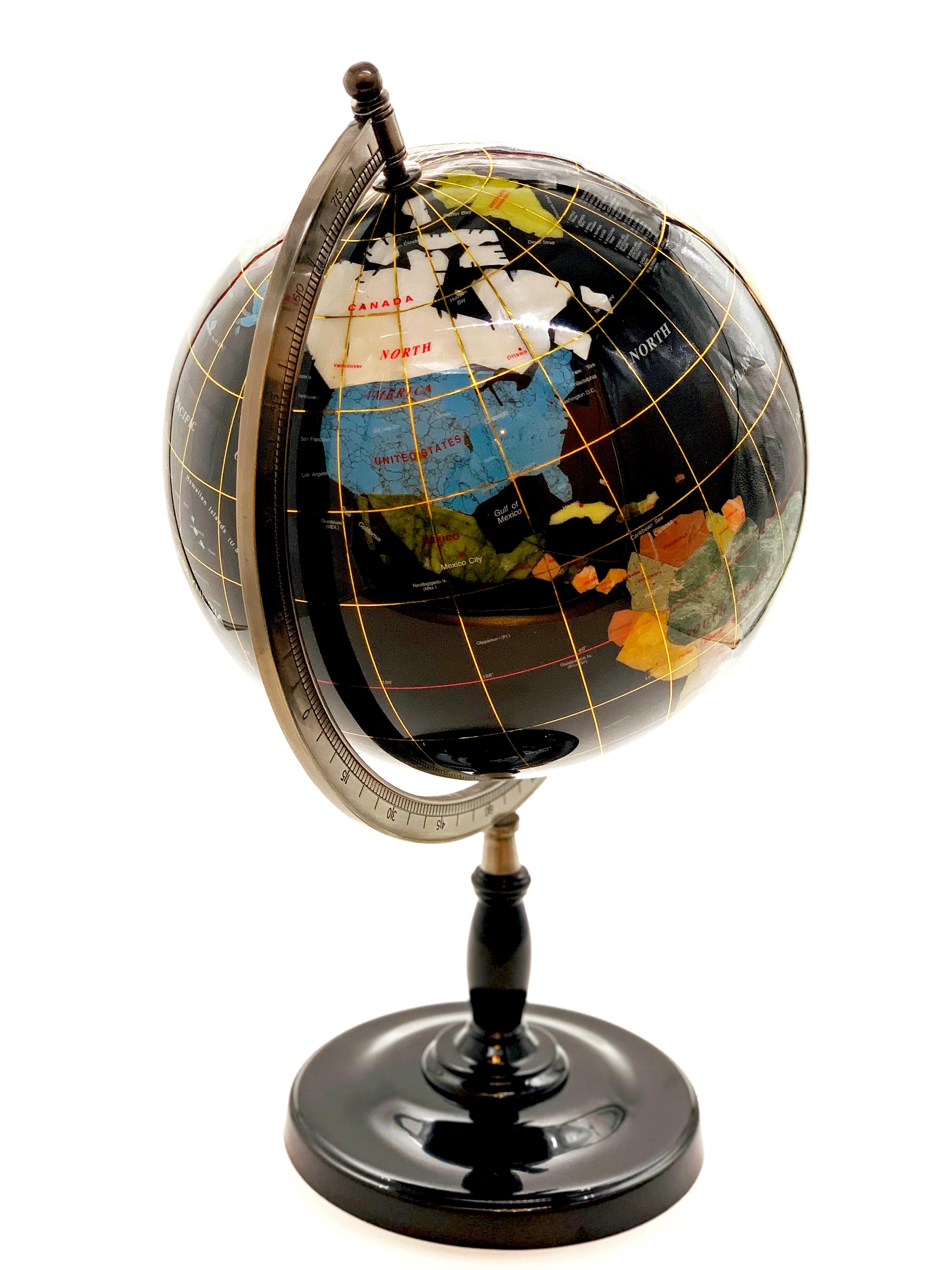 This beautiful globe has been handmade from high quality gemstones, semiprecious stones and shells.
Incredible detail, individual gemstone or shell for each country and then the globe has been coated with resin for protection.
The globe can rotate