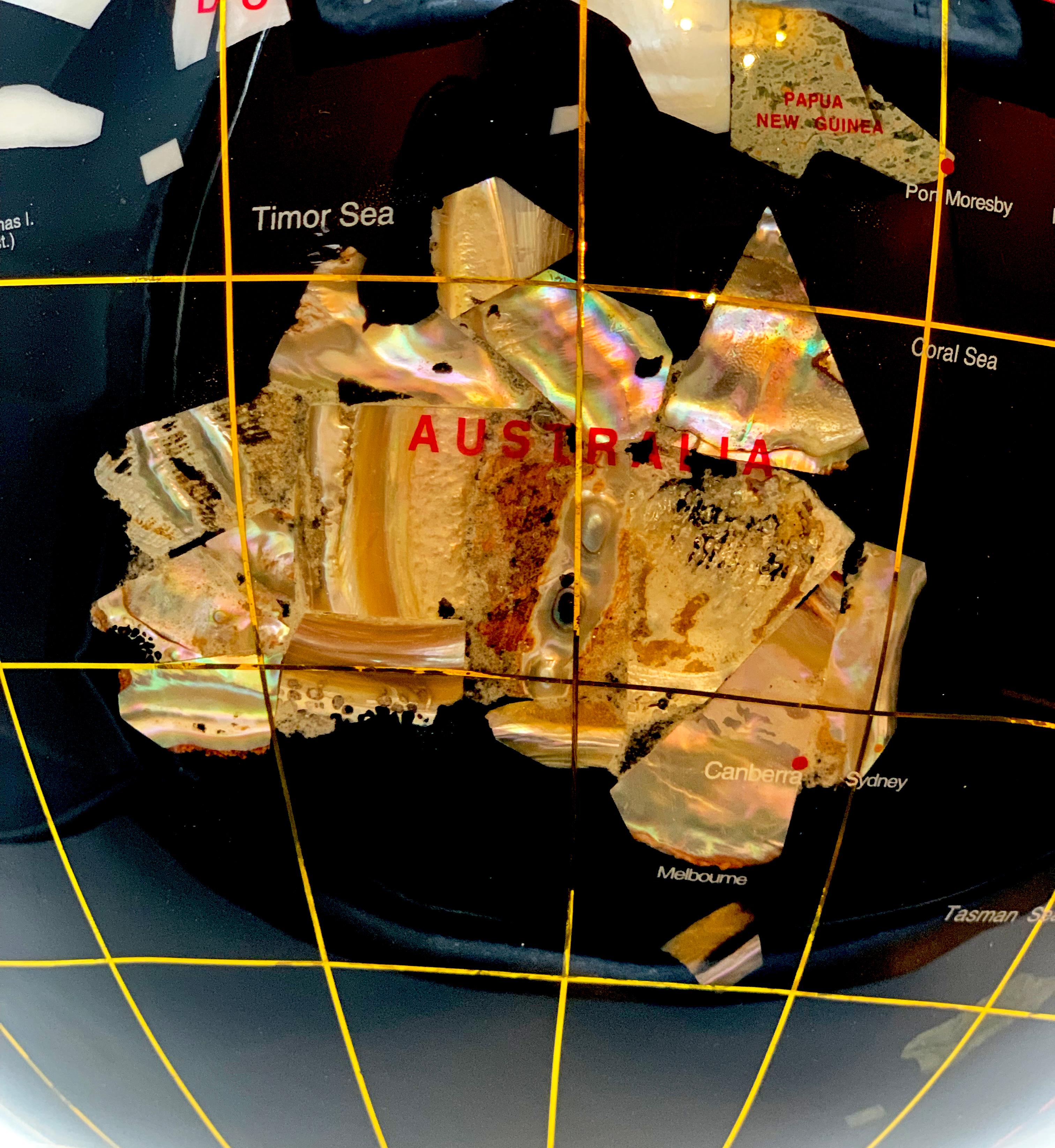 globe with stones