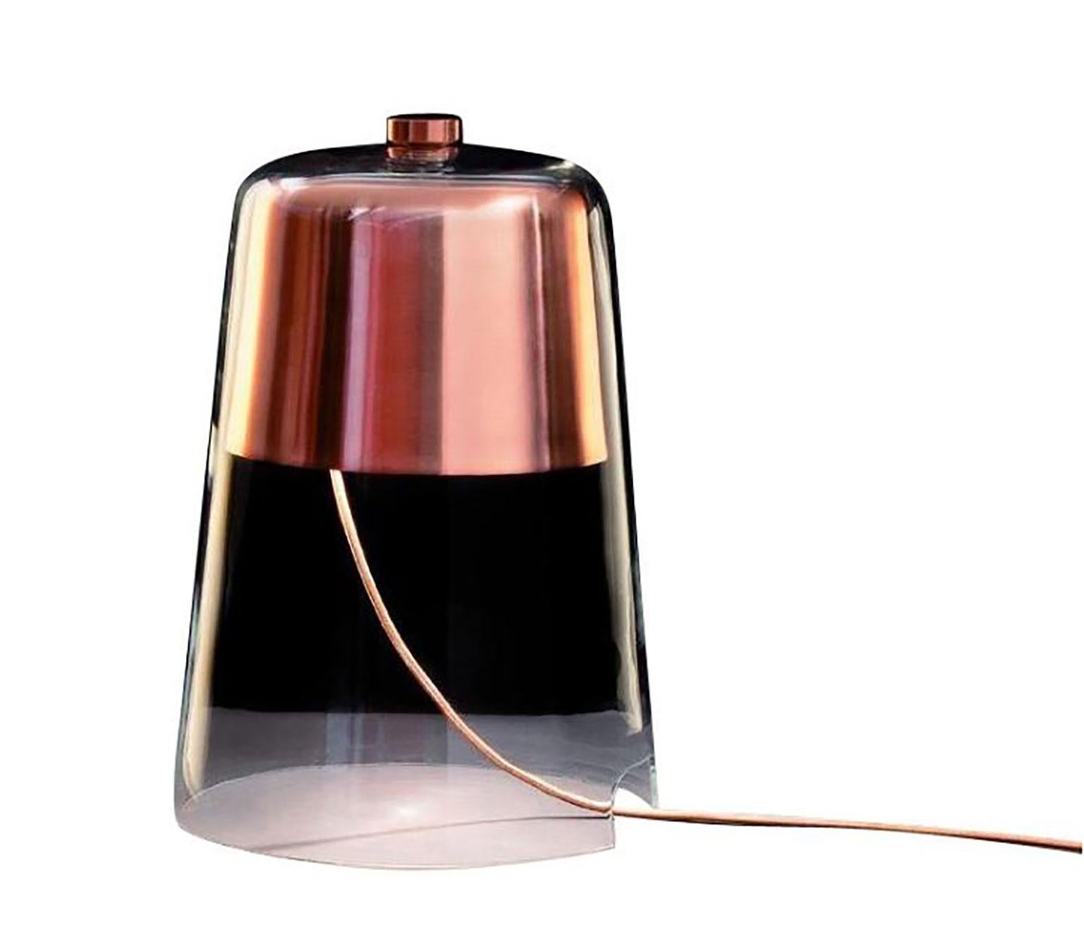 Semplice table lamp designed by Sam Hecht for Oluce. This elegant and simple design consists of a single blown glass bell, functioning as both the diffuser and the base for the fixture. The visionary simple combination of structure and design is