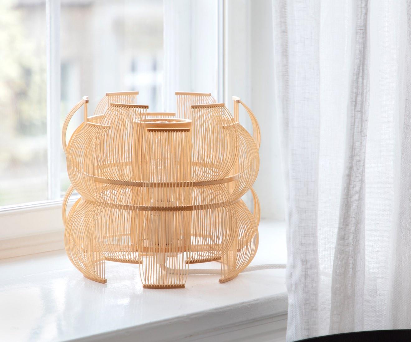 The SEN table lamp is a unique and contemporary piece of light art that builds on tradition while revitalizing traditional Japanese craftsmanship.  Also available as a pendant.

Sen means lines in Japanese and the many bamboo strips that are bent