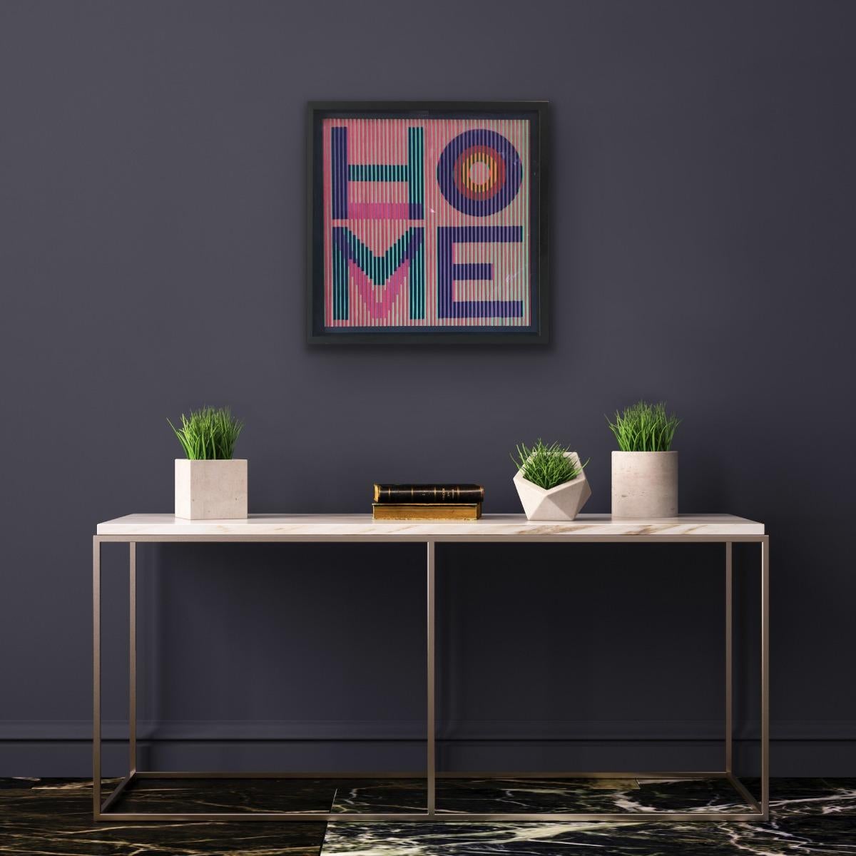 Bringing Love Home by Sena Shah is a new design created in October 2024. It is made with felt fabric and reflective paper that enables a lenticular effect causing the art to change as it is viewed from different angles. This version has the word