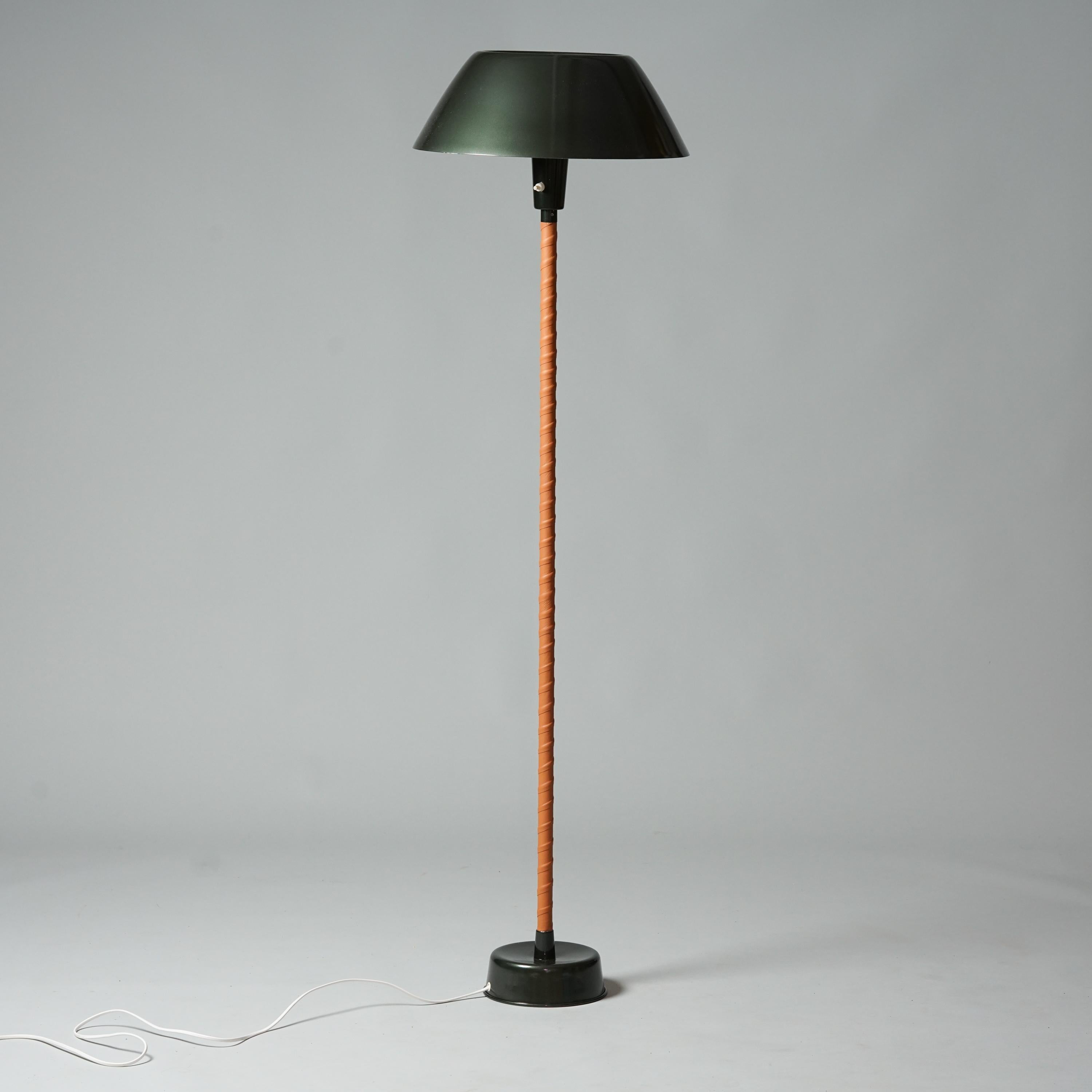 Senator floor lamp, designed by Lisa Johansson-Pape, 1960s. New leather wrapping, painted with original colors. Aluminum shade. Good vintage condition, minor patina consistent with age and use. Classic Lisa Johansson-Pape design. 

Lisa