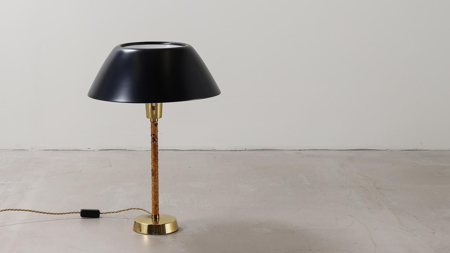 Senator table lamp by Lisa Johansson-Pape for Orno, 1947 in brass and lacquered metal with twisted original leather base.

Wired for U.K. 

Lisa Johansson-Pape (1907–1989) was a Finnish designer, most known for her lighting designs but also