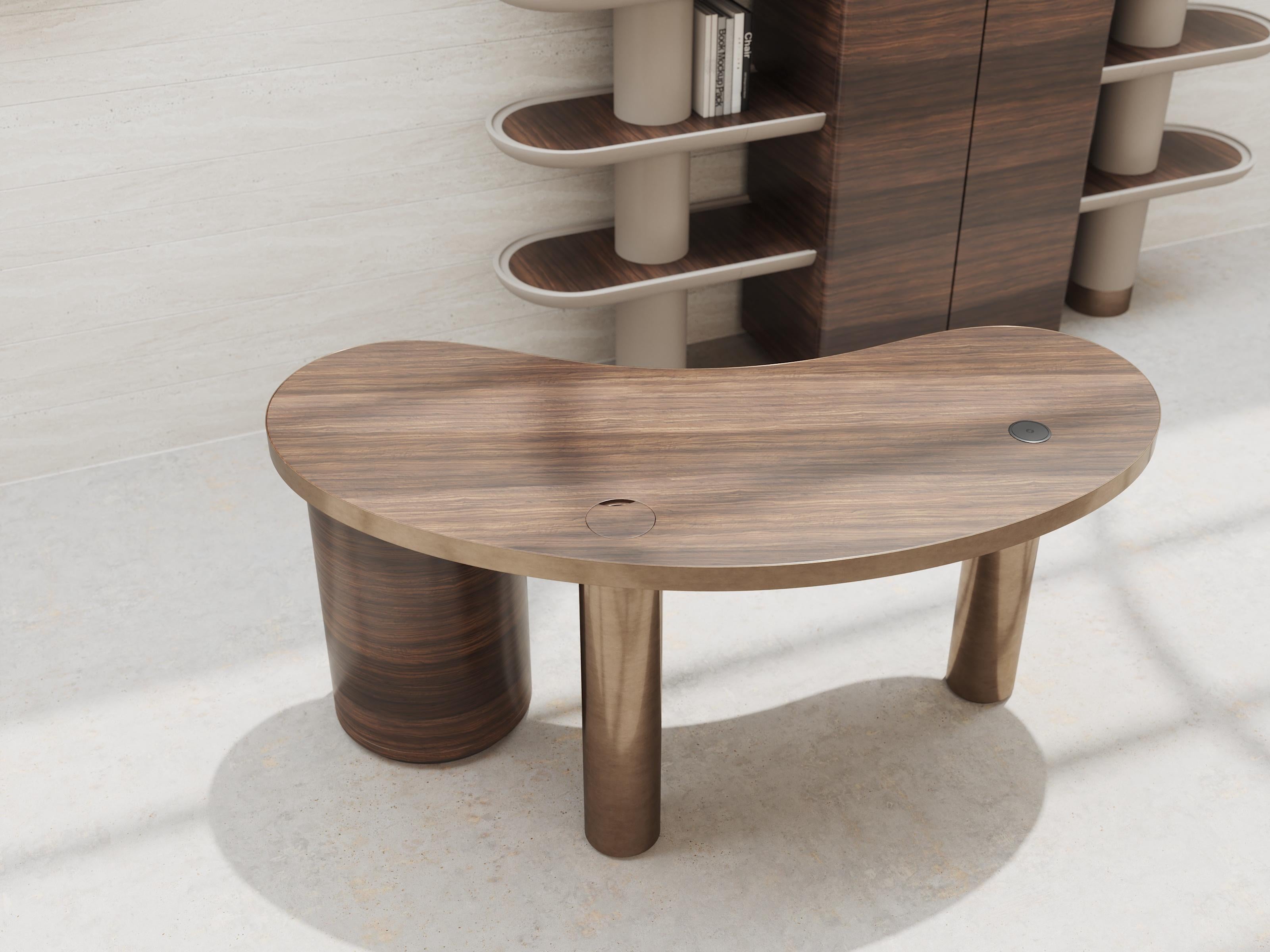Glossy smoked eucalyptus wood and brushed bronze interact in a marvelous interplay of finishes to characterize this fluid-lined desk as a piece of rare elegance. Incorporated in the column-like unit, four drawers add to the single one underlying the