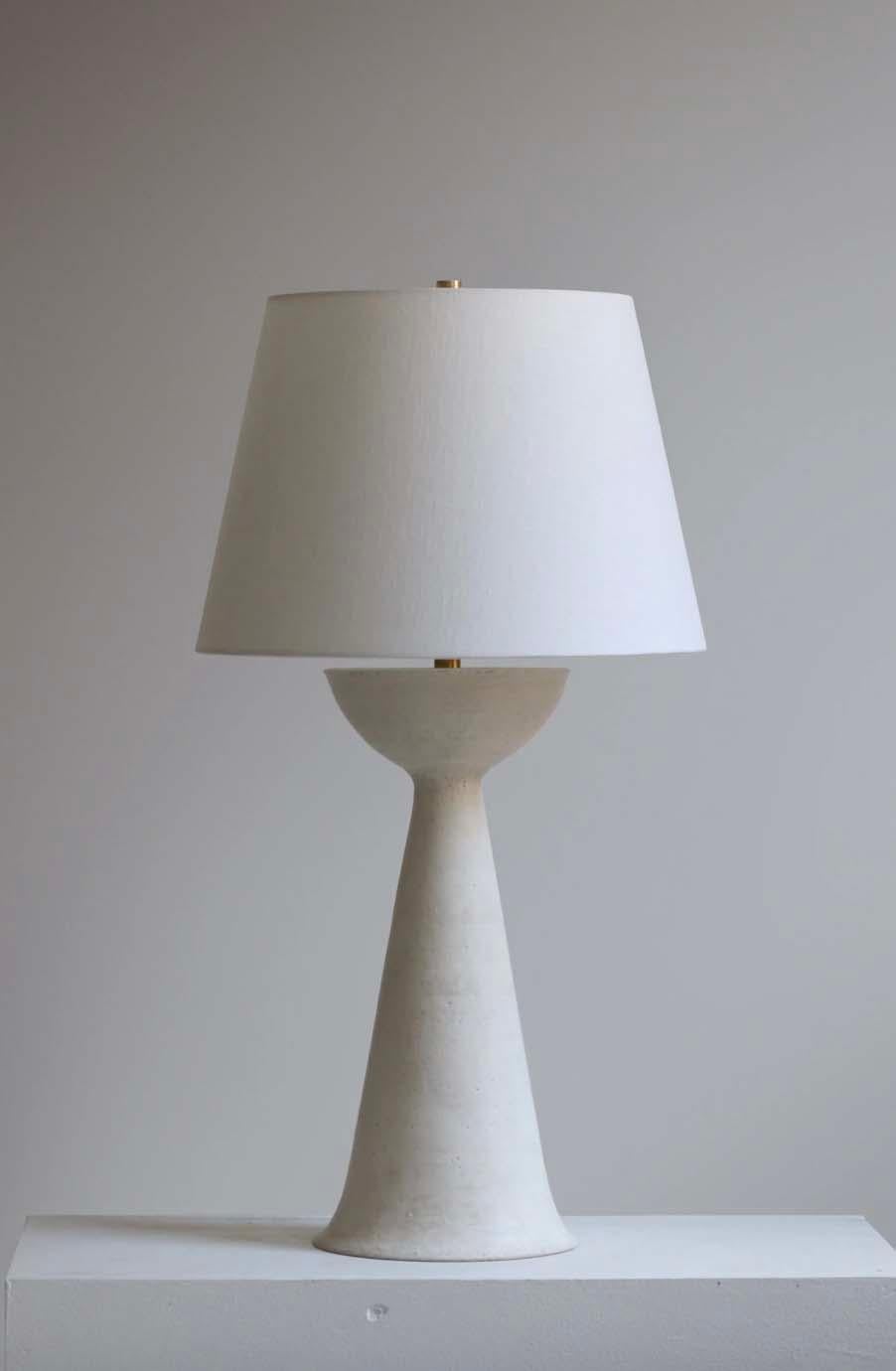 The Seneca lamp is handmade studio pottery by ceramic artist by Danny Kaplan. Shade included. Please note exact dimensions may vary.

Born in New York City and raised in Aix-en-Provence, France, Danny Kaplan’s passion for ceramics was shaped by