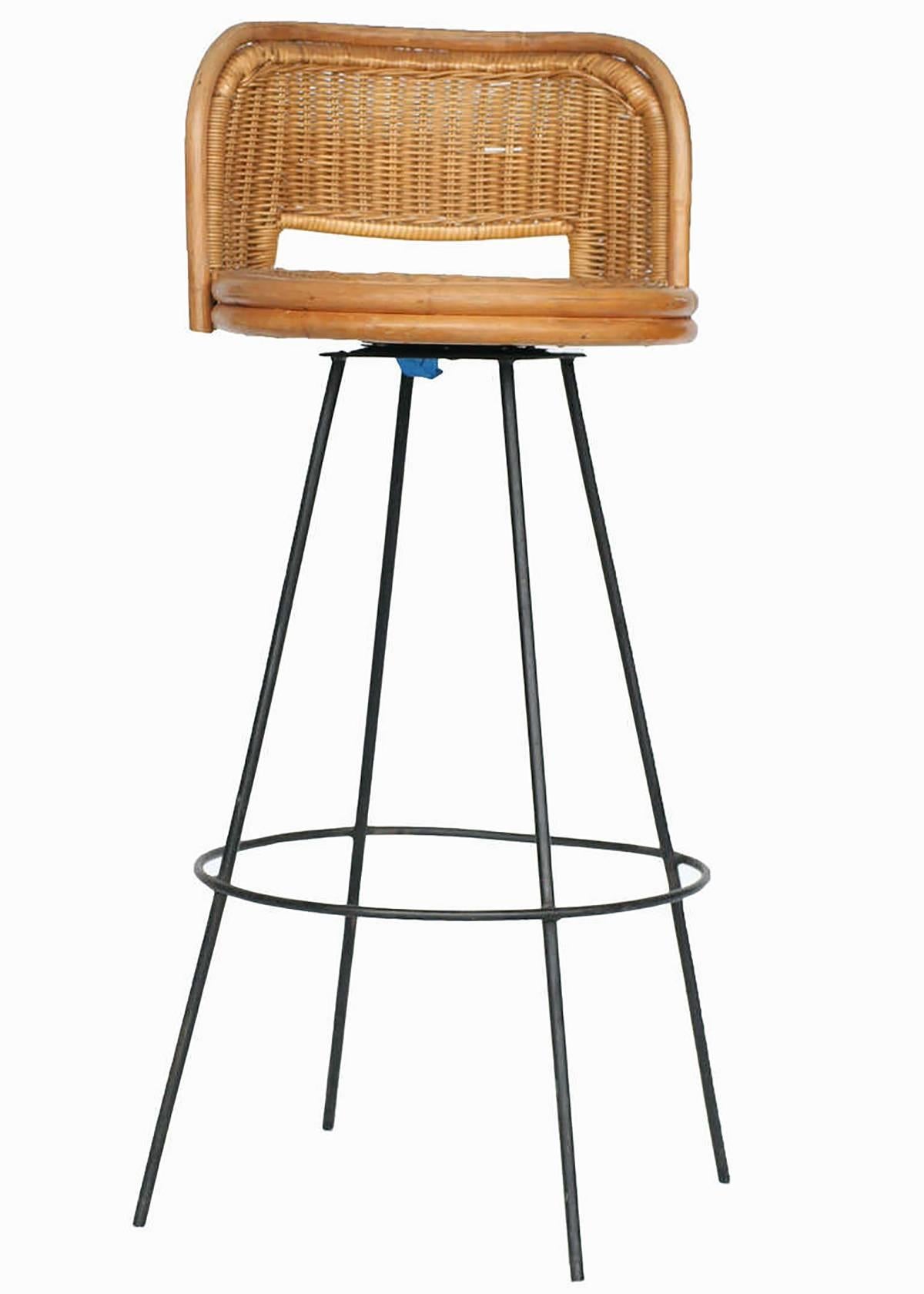 Seng of Chicago rattan and metal swivel bar stool pair with seat backs. This delicate combination of rattan and metal is a perfect match for any midcentury home or Tropical getaway. 

The rattan shows no signs of wear or breaks. The metal bases