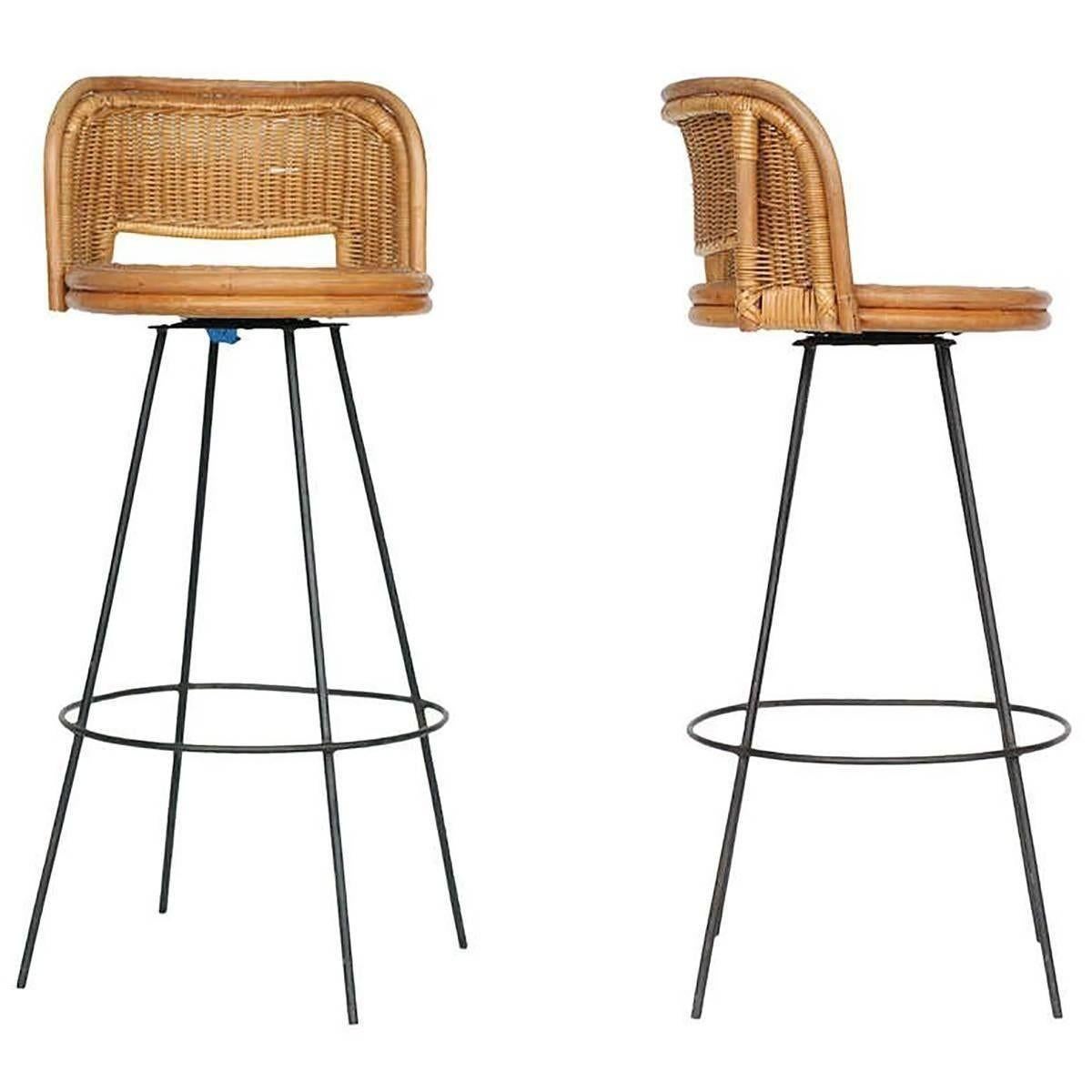 Seng of Chicago rattan and metal swivel bar stool set of 3 with seat backs. This delicate combination of rattan and metal is a perfect match for any midcentury home or Tropical getaway. The rattan shows no signs of wear or breaks.
 
The metal