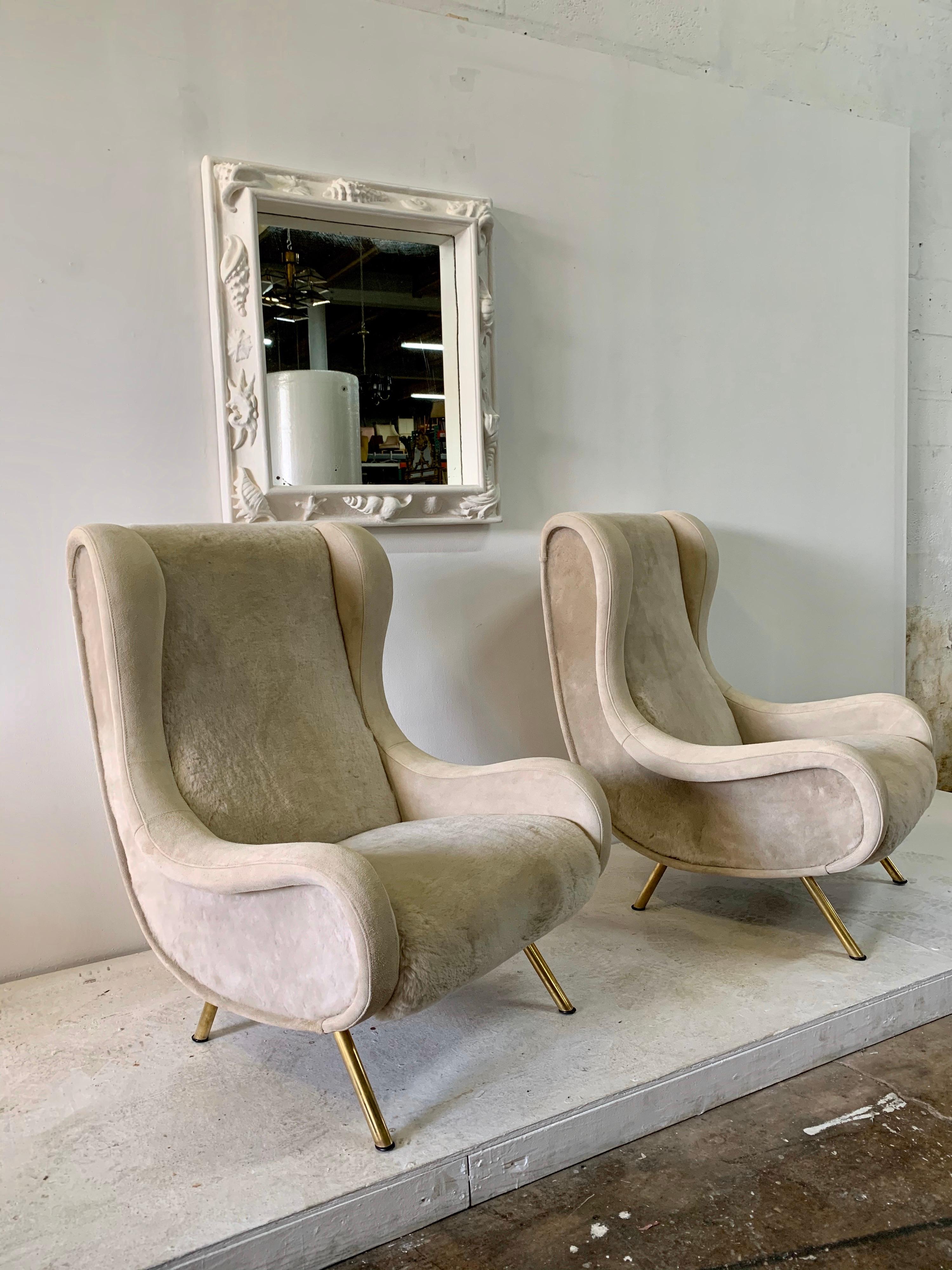 These over-the-top Senior Zanuso armchairs expertly restored and reupholstered in oatmeal toned shearling wool and natural suede accent and trim. Retaining original Arflex label, made in Spain in the 1960s. Wide and beyond comfortable. Upholstery of