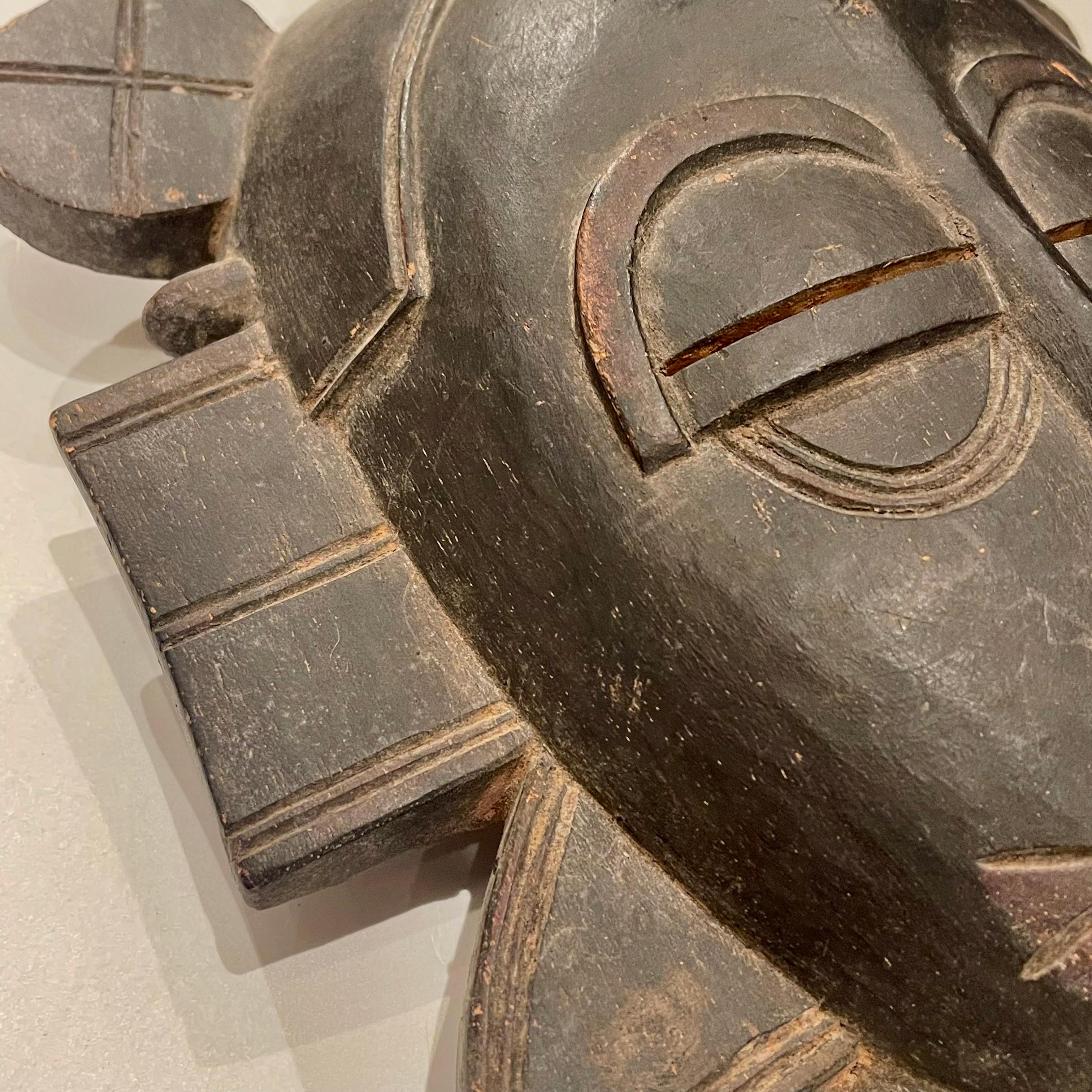Hand-Carved Senoufo Ivory Coast 'Kpelié' Initiation DancMask, First Half of the 20th Century For Sale