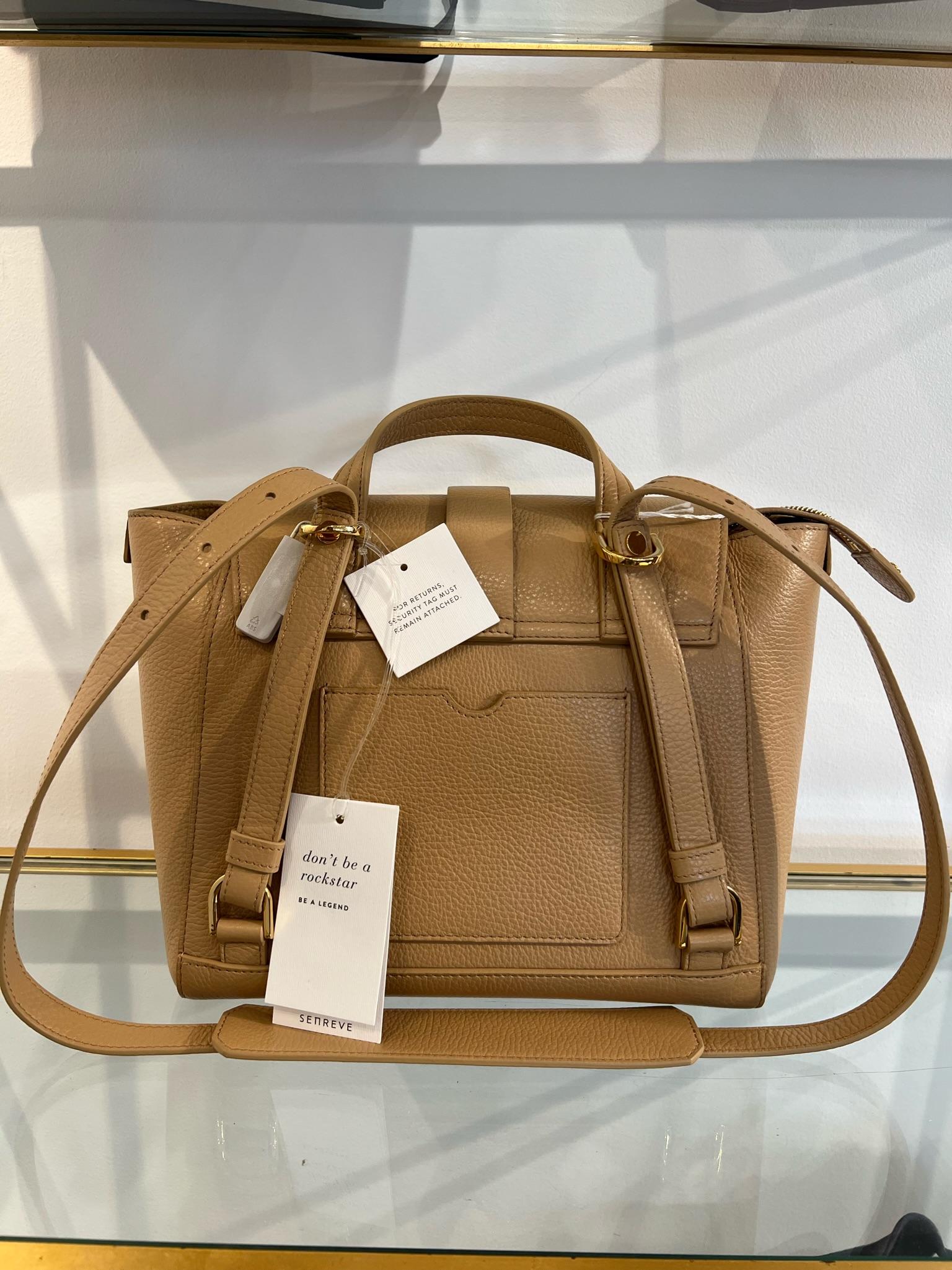 Designed For The Multi-Faceted Modern Woman, Senreve Beige Satchel Leather Backpack. Where beauty meets versatility.