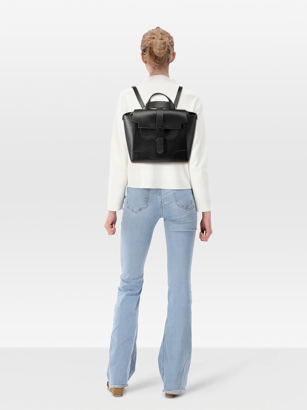 CONDITION is Very good. Minimal wear to the bag is evident. Scratching and tarnishing to the metal base feet. Marks on the corners of the front flap and the base. Pealing and cracking to the leather seal on the centre of the shoulder straps on this