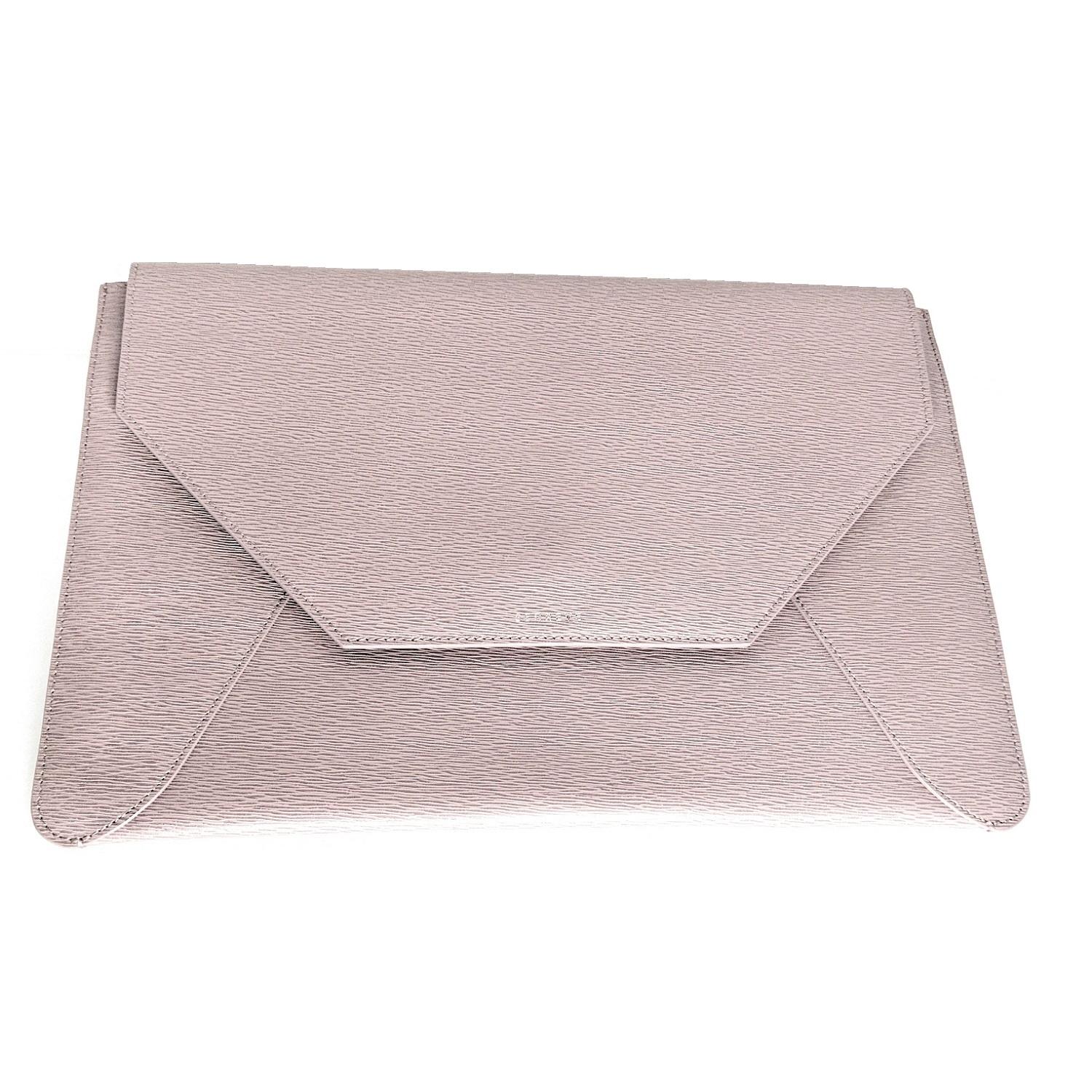 This elegant, leather-bound Envelope Sleeve is perfect for your laptop, work documents, and other daily essentials. It can be carried as an evening bag, computer case, or portfolio clutch. The main compartment fits up to a 13” MacBook. Retail price