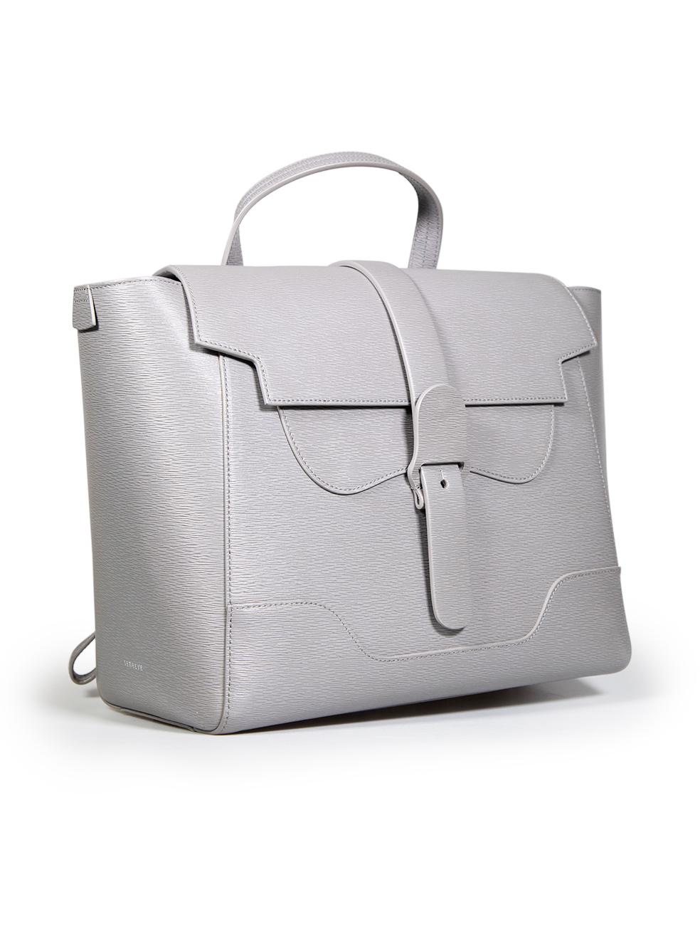 CONDITION is Very good. Minimal wear to bag is evident. Minimal discolouration mark on the left side of the bag on the front and the back, on the inner flap and there are some abrasions to the trim of the handle on this used Senreve designer resale