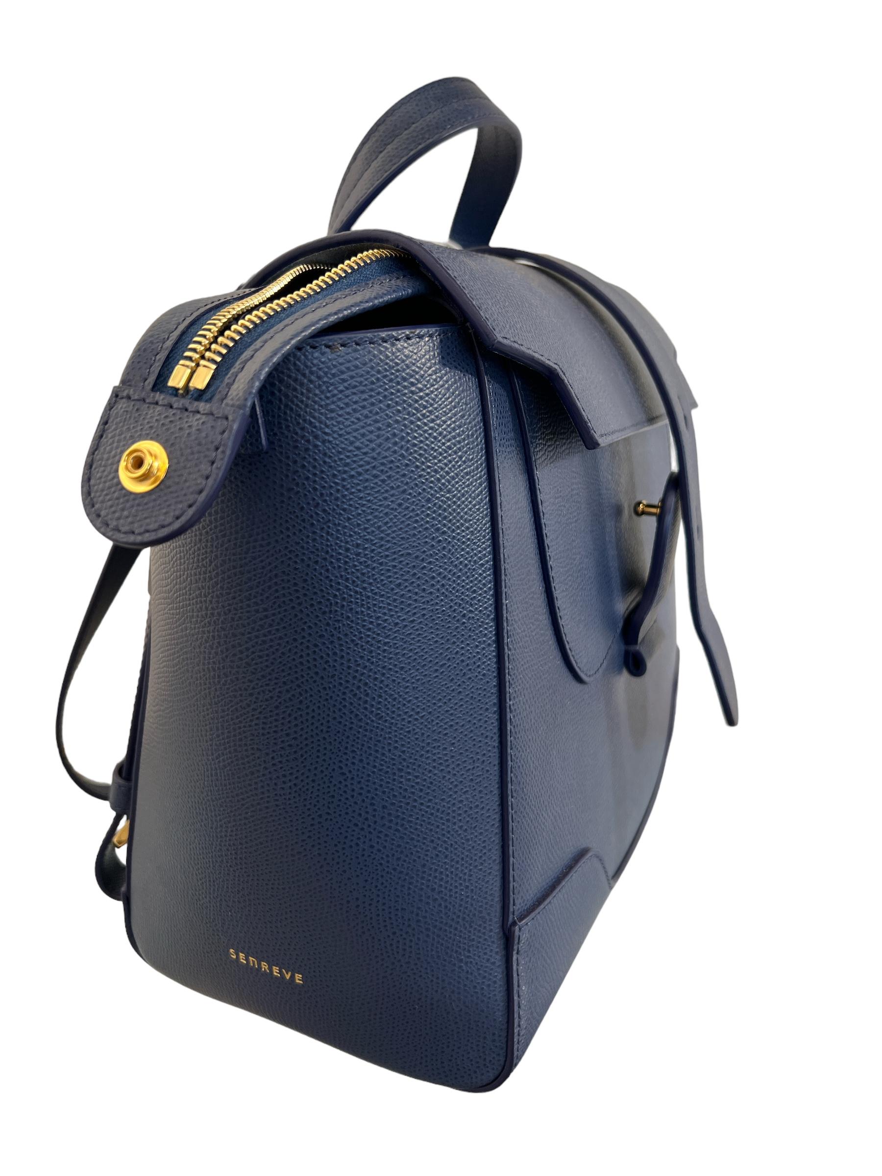 Designed For The Multi-Faceted Modern Woman, Senreve Navy Satchel Leather Backpack. Where beauty meets versatility.
