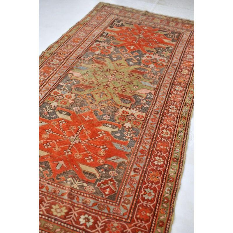 Sensational Caucasian Karabagh  Muted Rust, Pistachio/Soft Avocado Green, Charcoal, Pale Blue

About: Amazing piece

Size: 4.1 x 8.8
Age: Antique
Pile: Low with oxidizing charcoal/espresso volcanic ash black, genuine aged patina 

This rug is