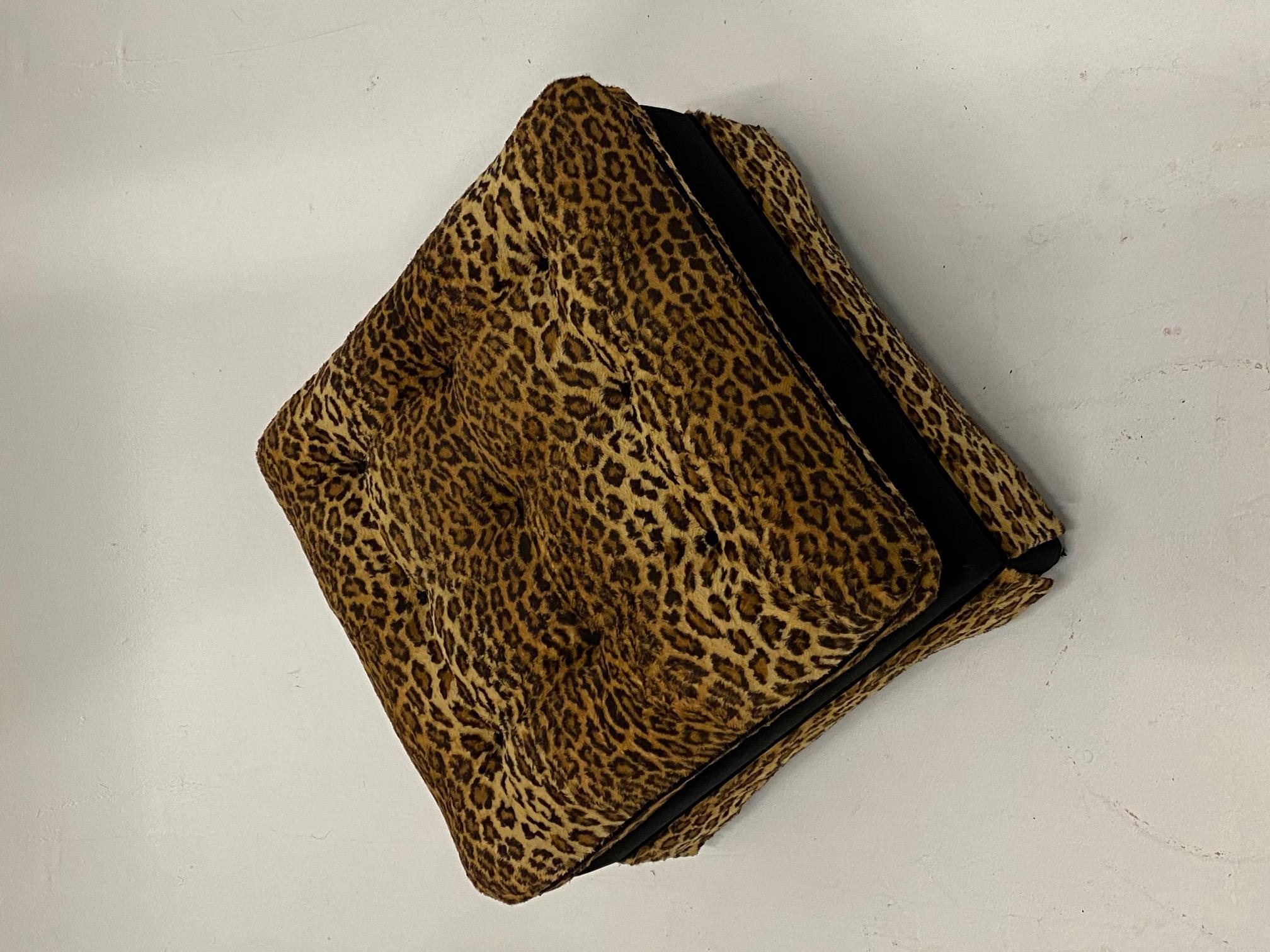 Sumptuous upholstered square custom ottoman in a striking combination of cut black velvet and leopard animal print.