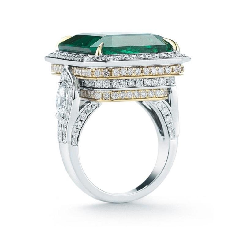 SENSATIONAL EMERALD AND DIAMOND RING Alternating tiers of diamonds set in white and yellow gold really bring this gorgeous dark hued 33 ct. Emerald to life Item: # 01984 Metal: 18k W / Y Lab: Gia Color Weight: 33.87 ct. Diamond Weight: 3.65 ct.


