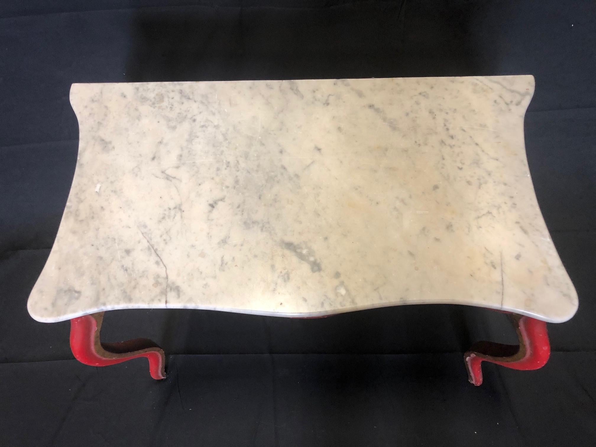 Beautiful French Louis XV Italian Carrara marble-topped hall table or console with original French red color and gold gilt inset.

#5232.