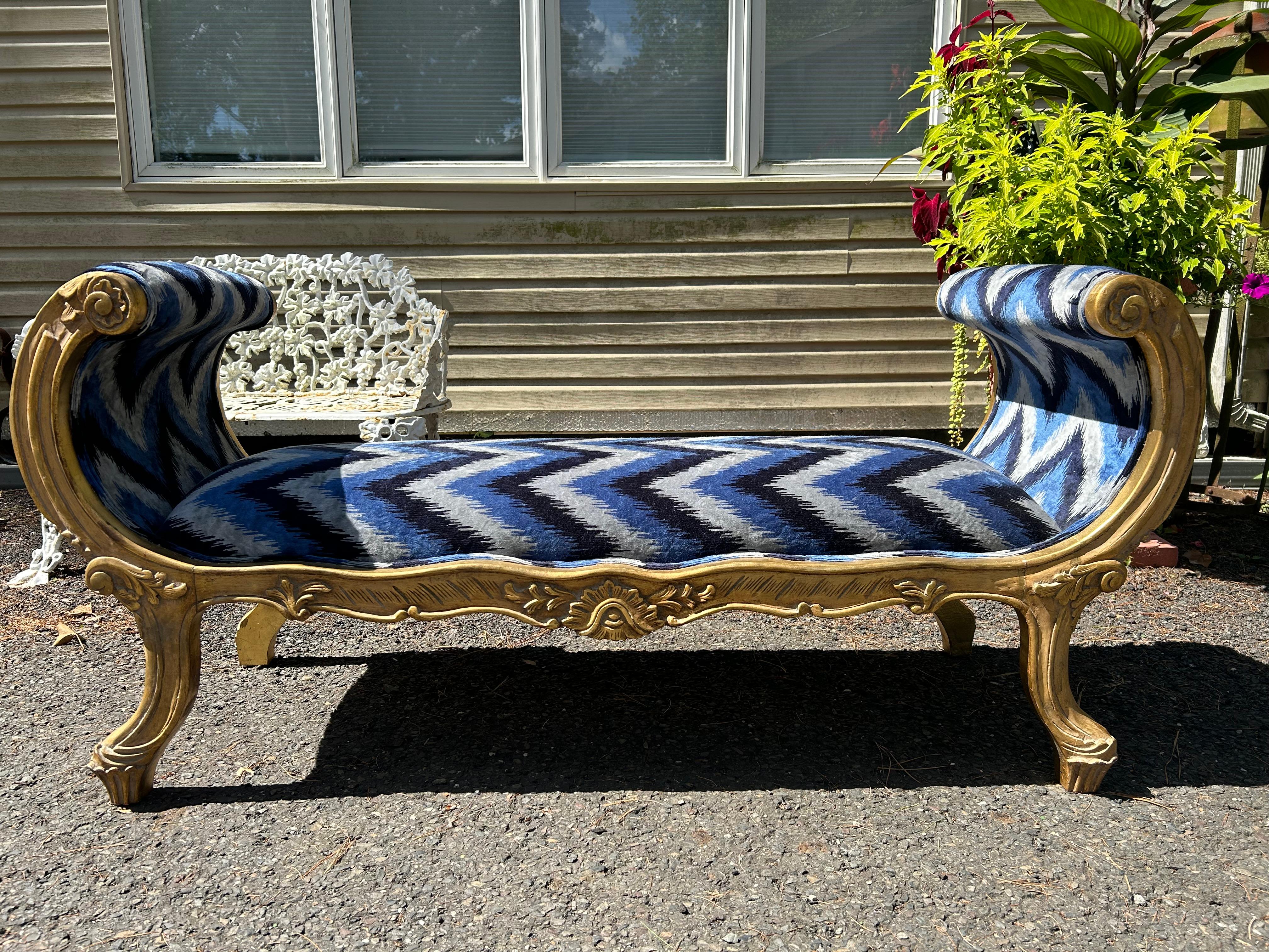 Sensational vintage French Louis XVI Style scroll arm Settee/Bench.  The bench has been reupholstered with high end Missoni style velvet and the frame is finished in gold lacquer. To keep the authenticity and warmth of this antique piece, the frame