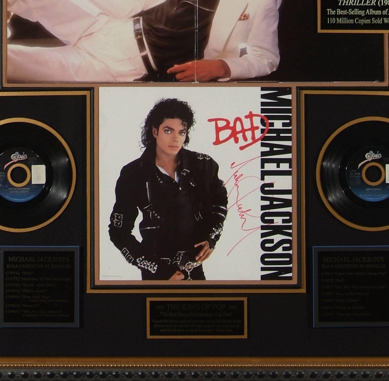 Sensational Michael Jackson autographed 'Bad' album framed memorabilia display 

• Featuring a rare bad album flat authentically hand signed in red by Michael Jackson.
• Framed with all 14 of Jackson’s record breaking #1 singles, as well as the