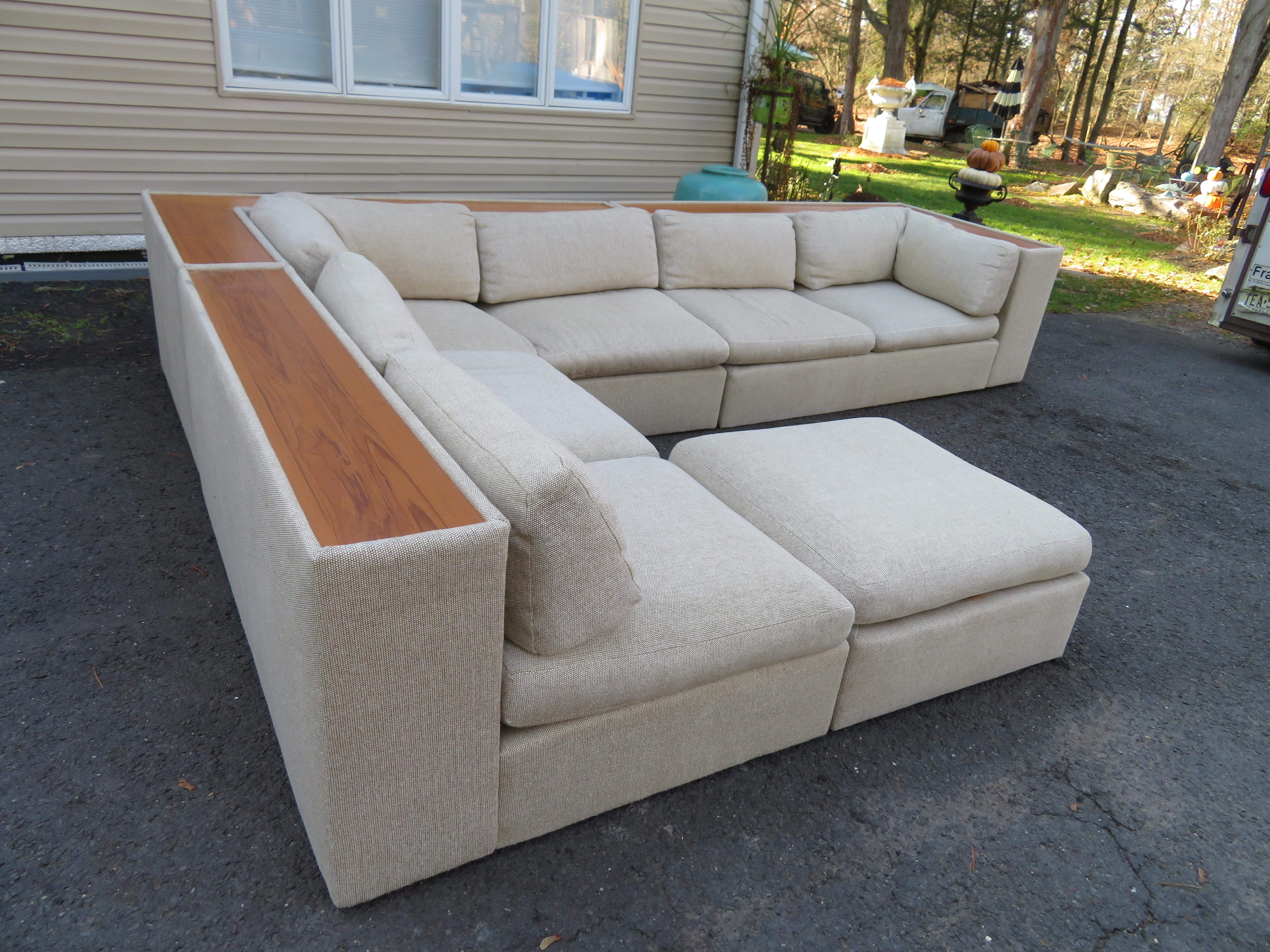 Sensational Milo Baughman for Thayer Coggin 4 piece sectional sofa. This is the holy grail of Milo Baughman sectionals with its chunky profile and a built-in walnut ledge along the entire back. The original fabric still has some life left in it but