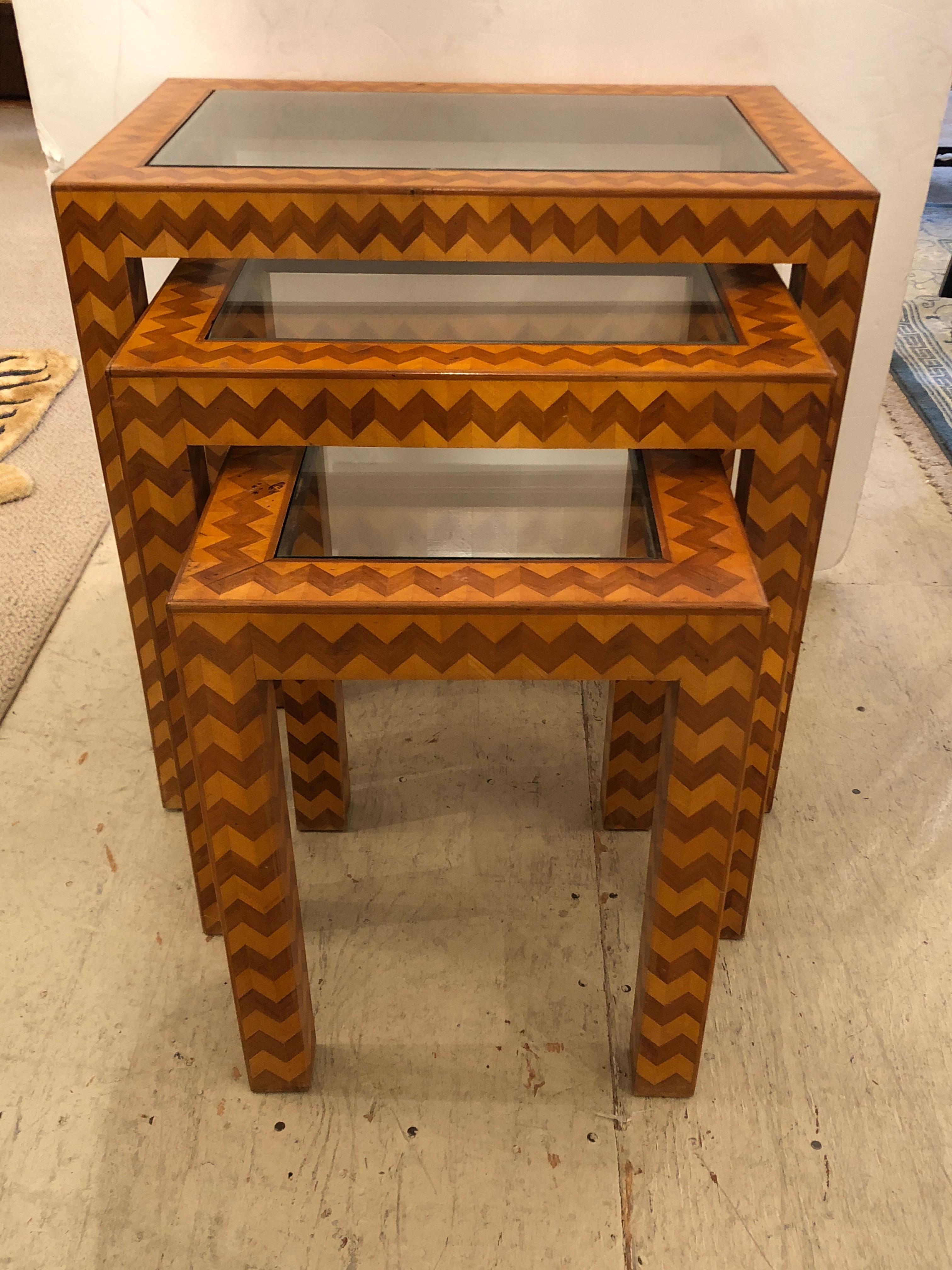 Gorgeous set of 3 Italian nesting tables that have an eye-catching decorative zig zag pattern with mahogany and satinwood marquetry.
Little table measures: 13.75 x 13.5 x 17.75
Medium 18.75 x 15 x 20.75
Largest 23.75 x 16.25 x 23.5.
