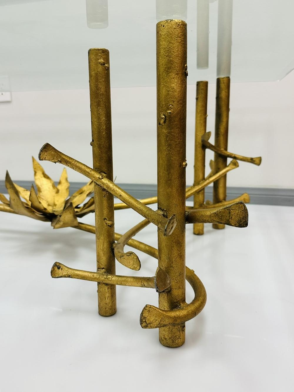 Sensational set of 3 tables in the manner of Silas Seandel including a large rectangular coffee table, triangular drinks table (28 x 18 x 19.75), and larger end table (29.75 x 20 d x 19.75 h). The bases are incredible distressed gold metal having