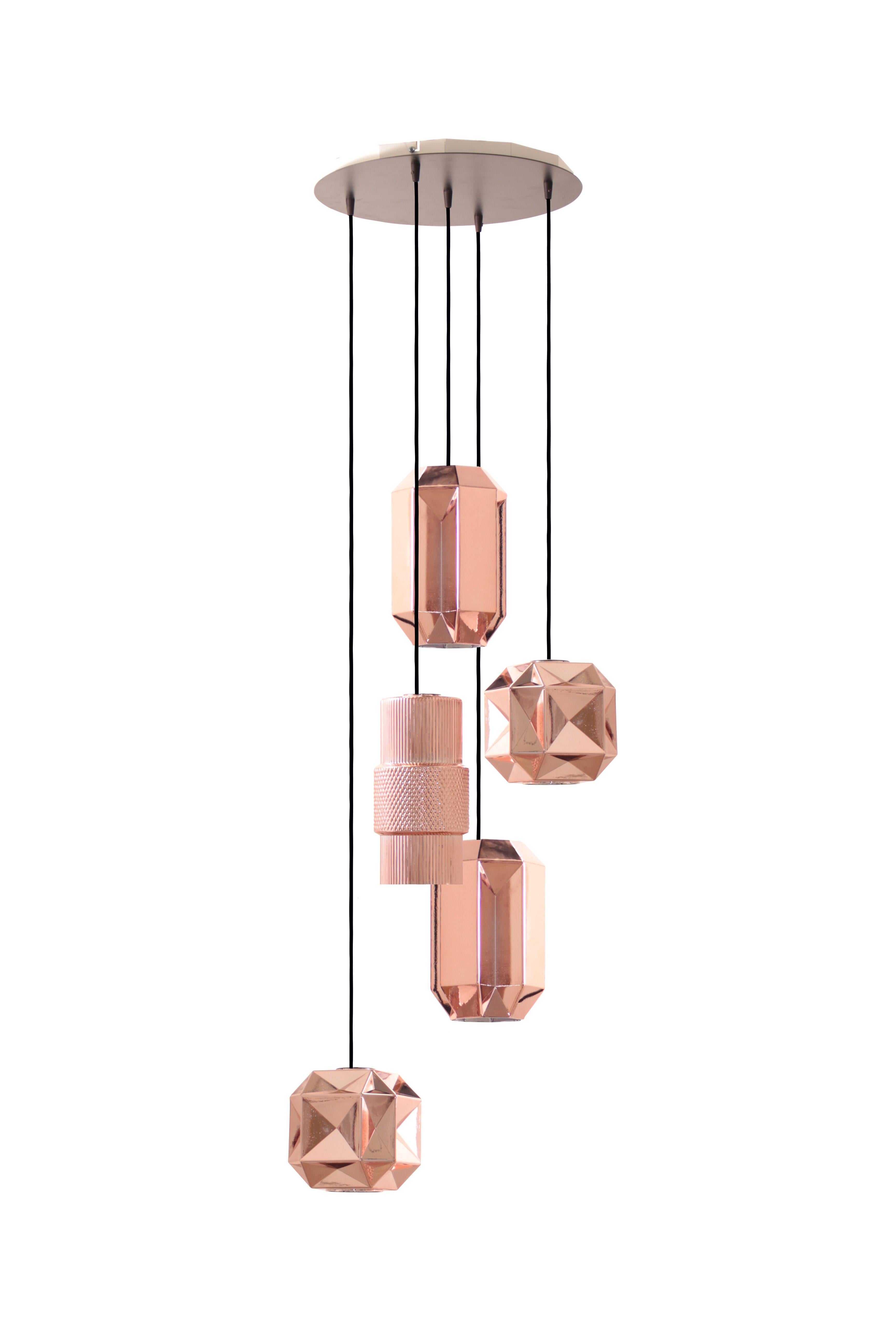 Hand blown glass pendants. 5 geometric glasses on 42 cm round canopy. 

Composed of the models Babel, Pharos and Colosseo, Senso pendant lights pay homage to the strength and presence of ancient monuments. Carved from a single block of glass, each