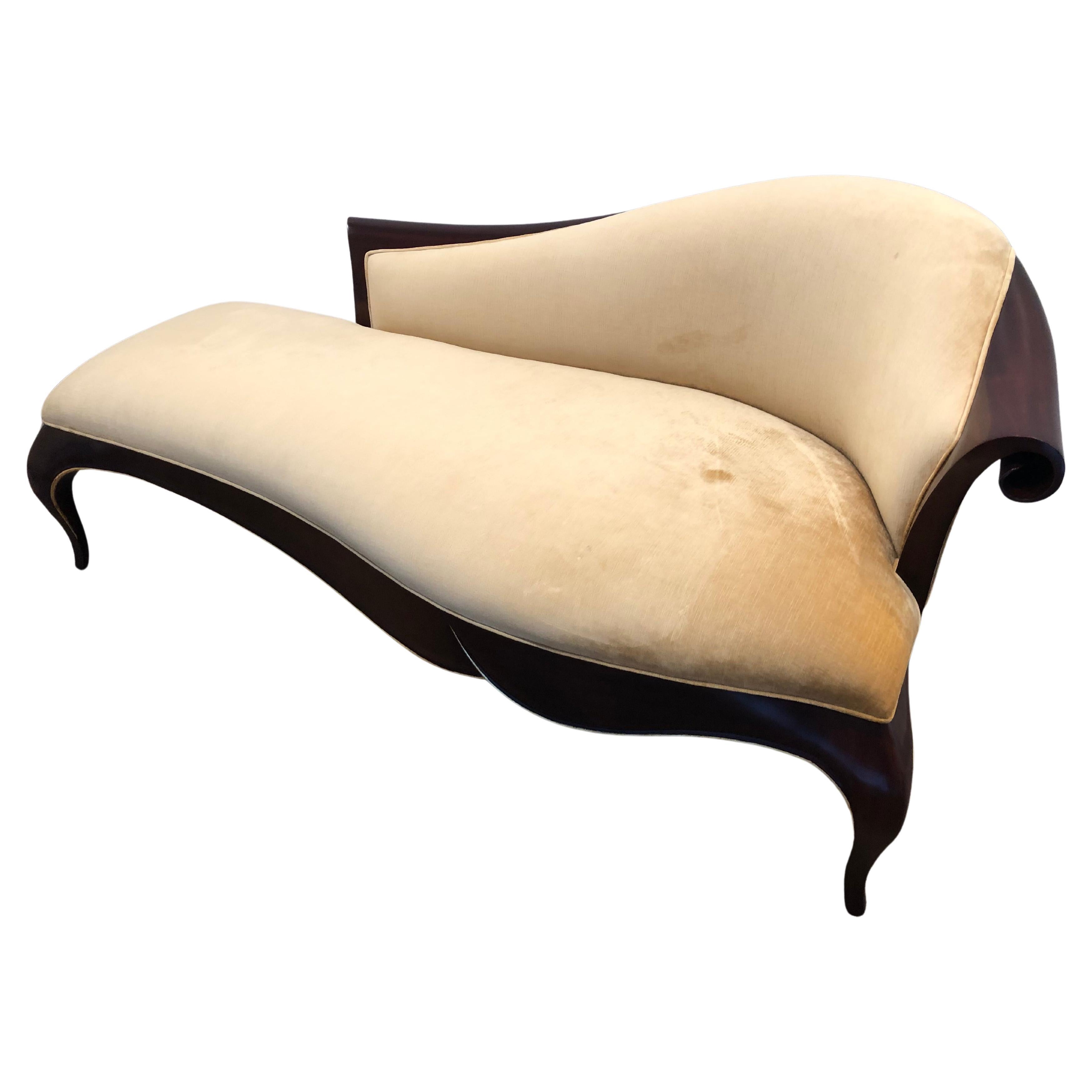 Moviestar glamourous chaise longue by Christopher Guy having sensual silhouette with art deco inspiration.  Beautiful glossy java finish mahogany with gilded edging and lovely velvet upholstery.  Pair of extra pillows included.