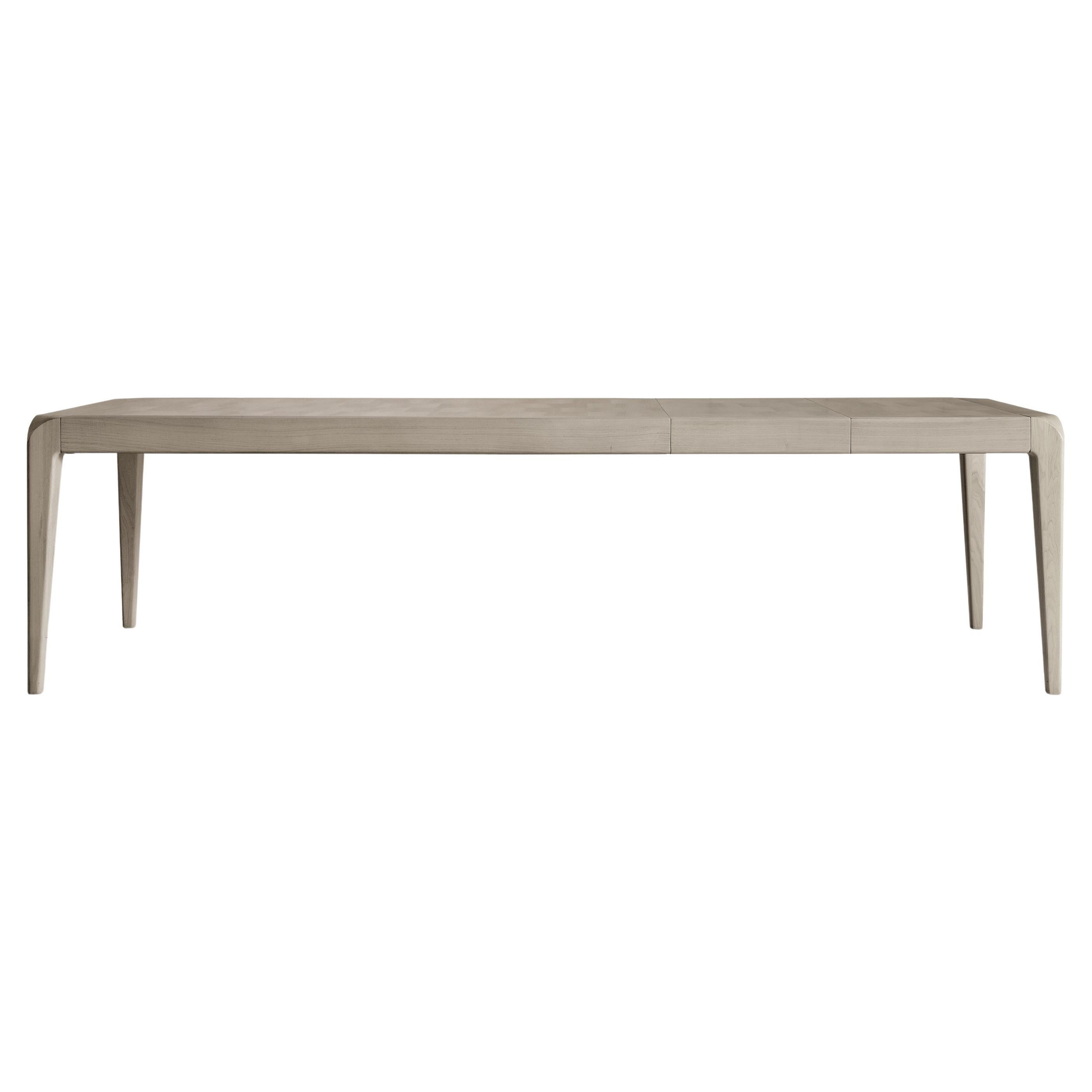 The Sentiero extendable table in solid wood is the expression of contemporary design and high quality Italian craftsmanship. Rectangular in shape, it features structure and legs in precious gray or natural walnut with inlay and wood finish. The