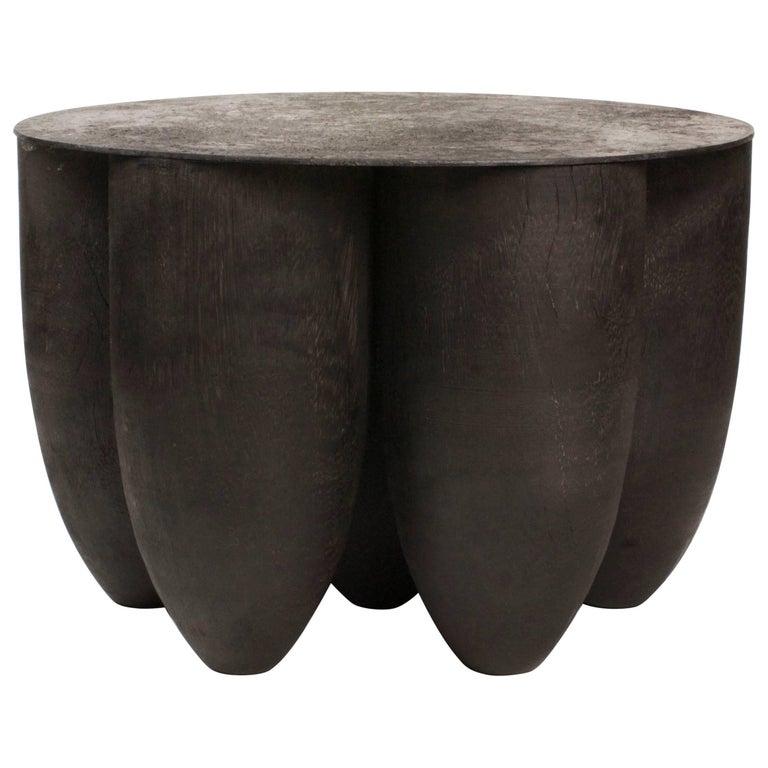 Senufo coffee table in Iroko wood by Arno Declercq
Dimensions: 45 x 45 x 30 cm
Iroko wood and burned steel

Arno Declercq
Belgian designer and art dealer who makes bespoke objects with passion for design, atmosphere, history and craft. Arno