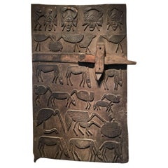 Porte granaire représentant une série d'animaux et de masques Senufo