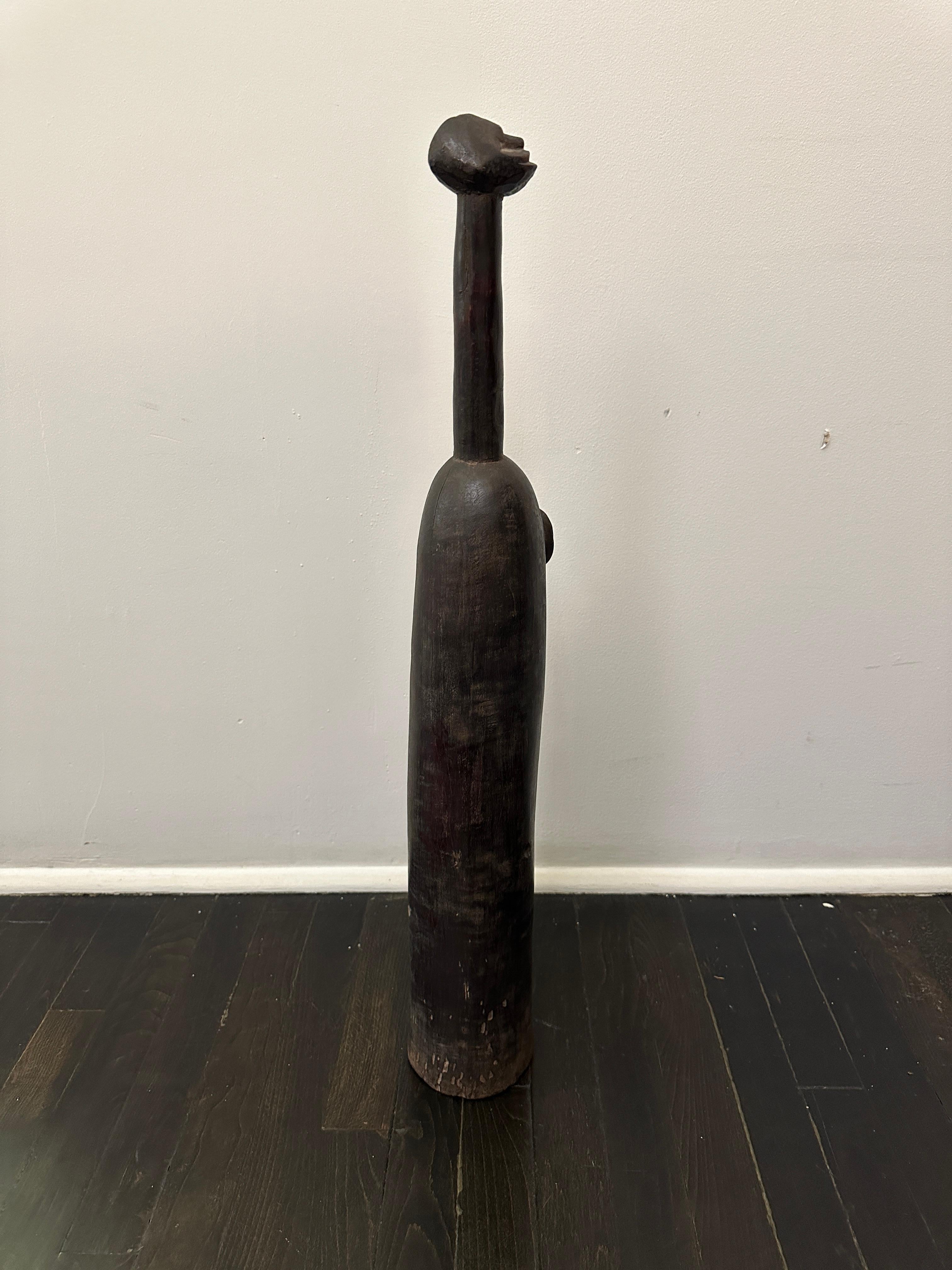 Africain Flute rituel Senufo en bois sculpté à la main en vente