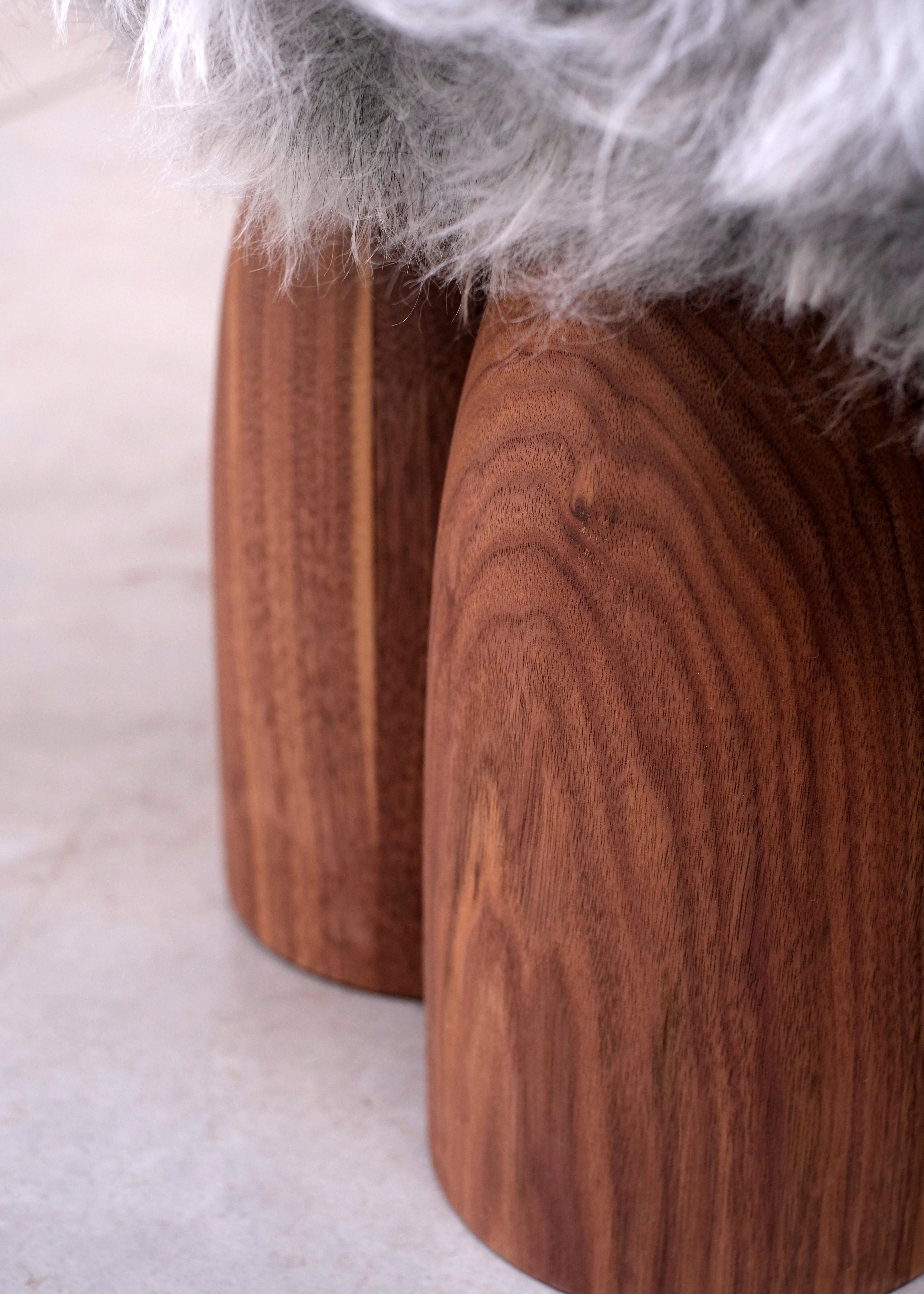 Senufo ottoman in American walnut by Arno Declercq
Made American walnut and sheep wool. (ask for different wool colors)
*Fur color based on availability
Measures: L 45 cm x W 45 cm x H 40 cm, L 17.7” x W 17.7” x H 15.7”

Material: American