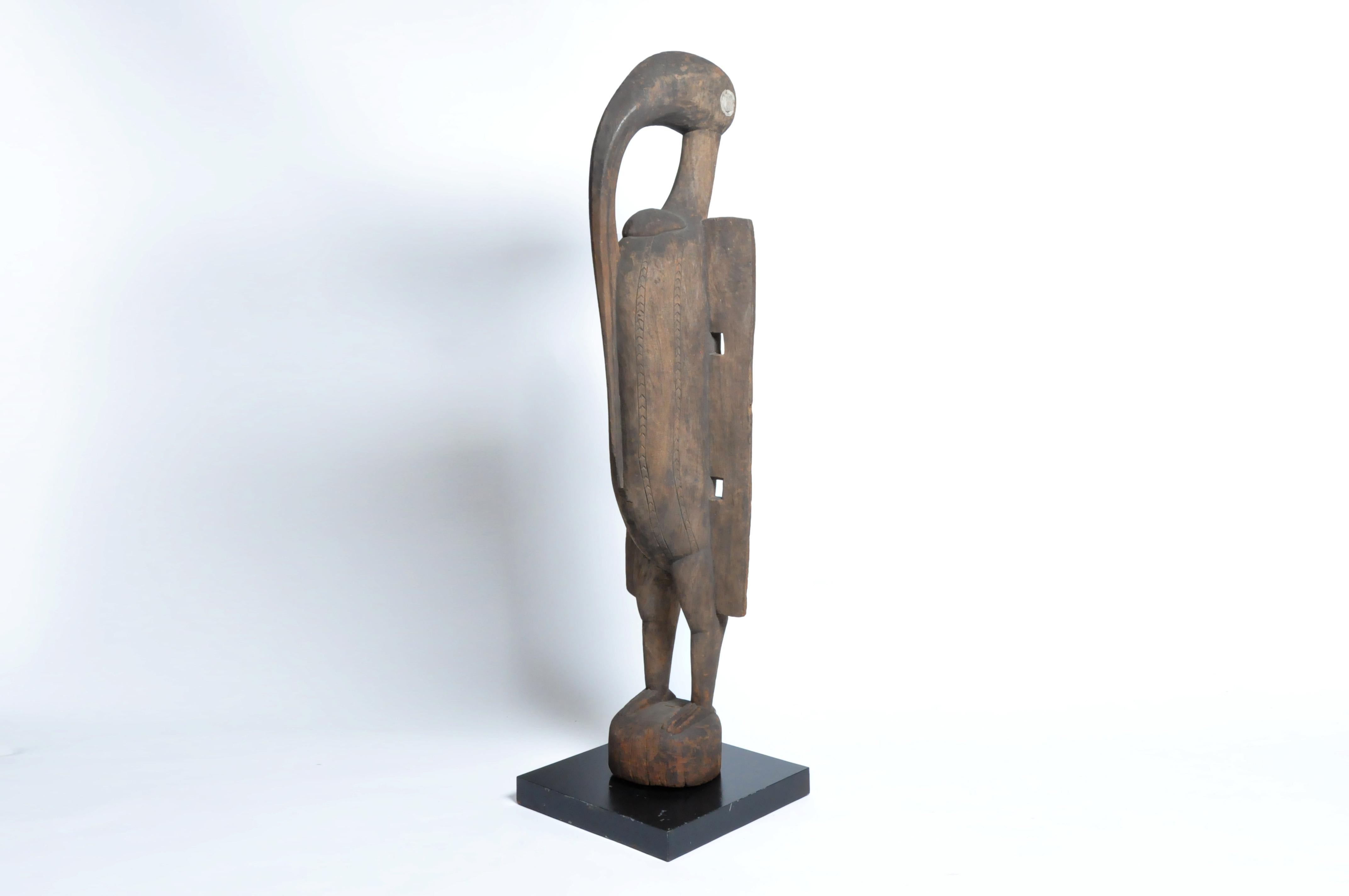 This is a sculpture of a hornbill from the Senufo Tribe located in Ivory Coast, Africa. Hornbill figures, called Setien or Porpianong, were used by the Lo and Poro societies. A symbol of fertility and the original ancestor cult, the hornbill was the