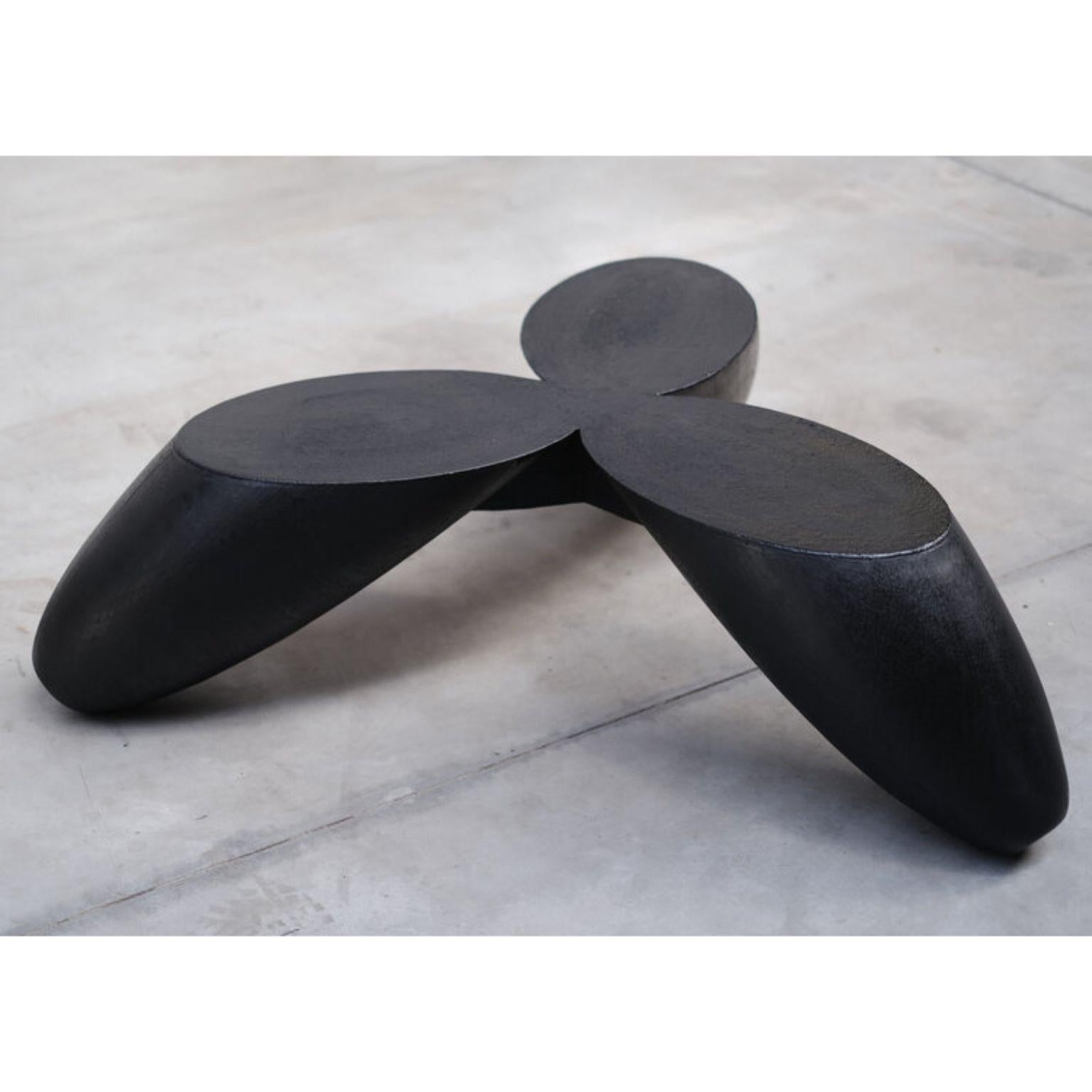 Senufo tripod coffee table by Arno Declercq
Dimensions: W 108 x L 108 x H 30 cm
Materials: Made in burned and waxed iroko wood, burned steel.

Arno Declercq
Belgian designer and art dealer who makes bespoke objects with passion for design,