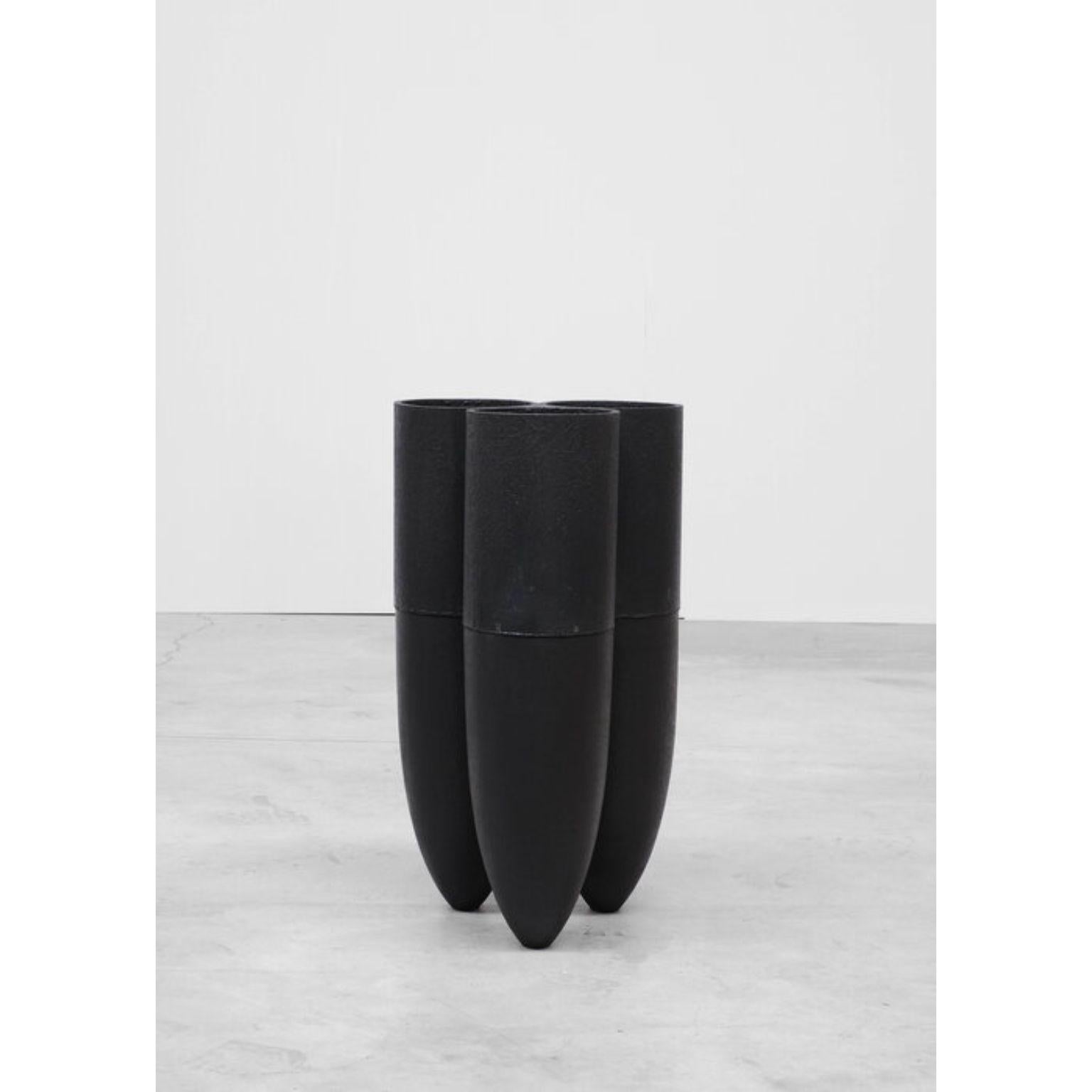 Senufo vase, Arno Declercq
Dimension: D 30 x W 30 x H 50 cm 
Materials: burned and waxed Iroko wood and burned steel.

Arno Declercq
Belgian designer and art dealer who makes bespoke objects with passion for design, atmosphere, history and